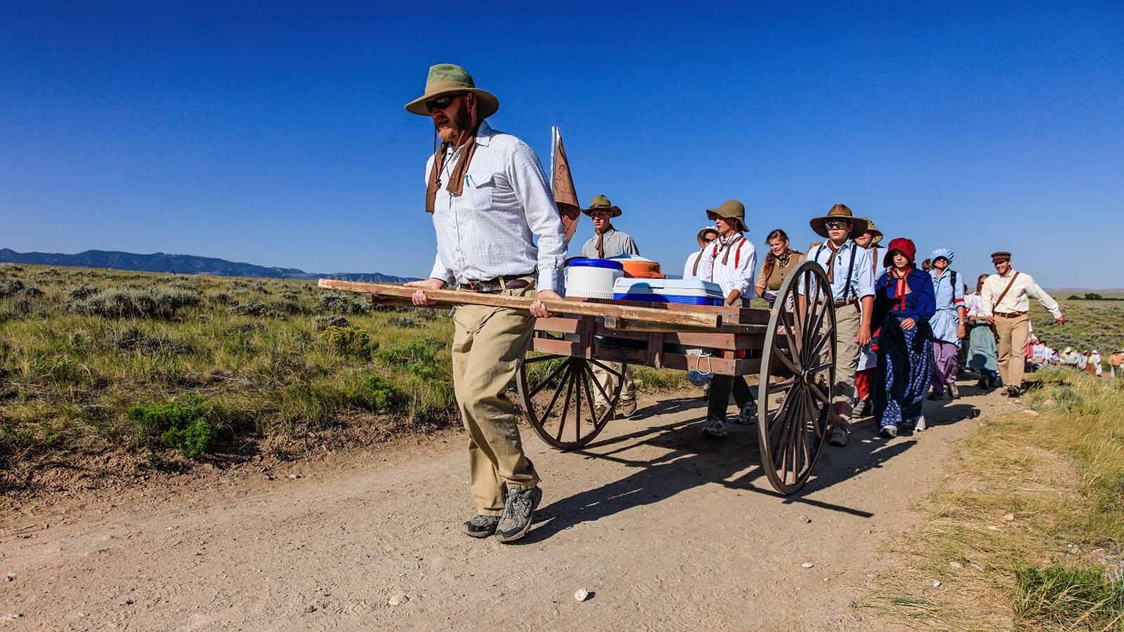 Members of the Church of Jesus Christ of Latter-day Saints walk along the Wyoming Mormon Trail near Lander, reenacting the trek of their forbearers who passed through during the 1800s while journeying toward Salt Lake City.