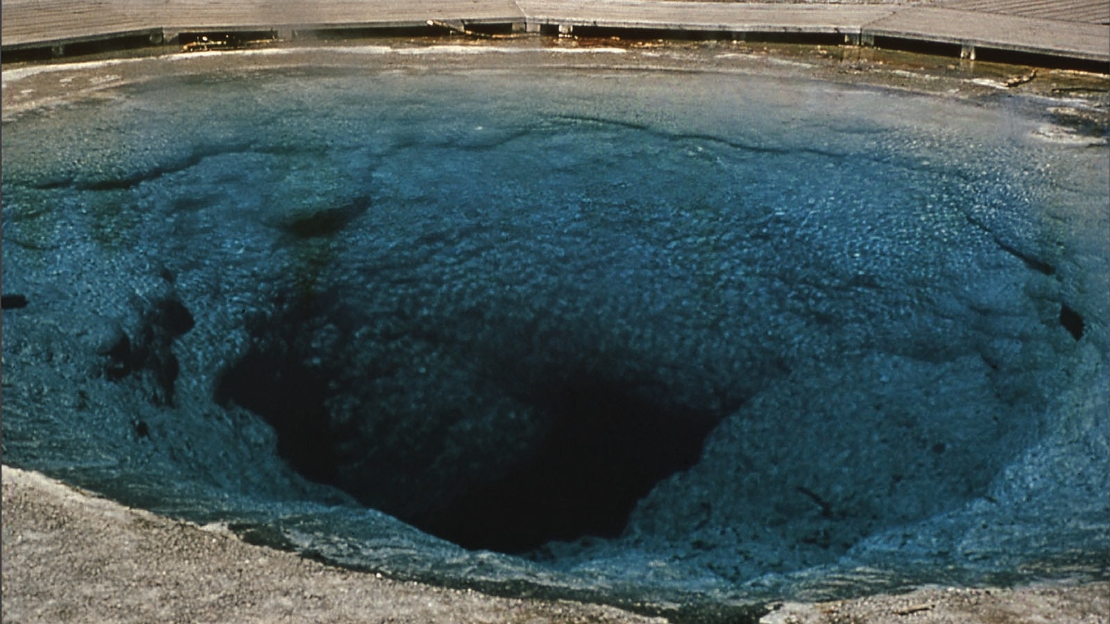 Morning Glory Pool used to be clear blue in color, but its close proximity to the road leading to Old Faithful has meant tourists throwing so much trash into it that it lost its original color.