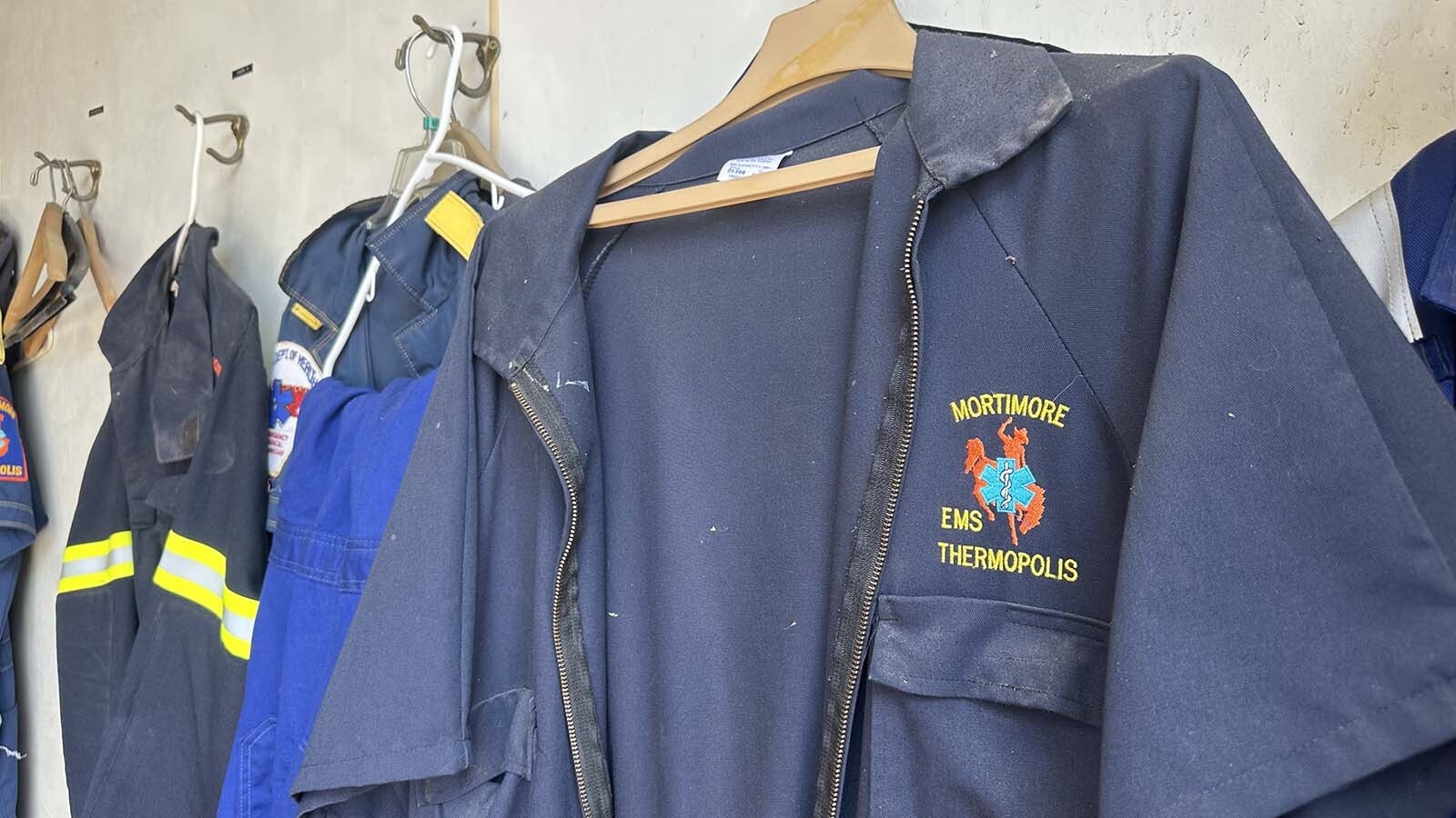 Clark Mortimore designed the bucking horse medical logo that adorned the emergency service uniforms since the 1960s. The uniforms are being retired as the Mortimore Ambulance Service is being liquidated and the family will concentrate on the funeral home.