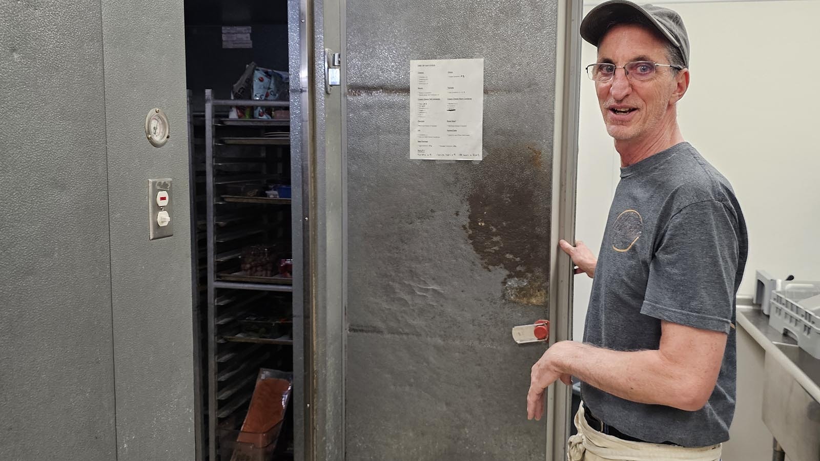 Mort's Bagels owner Bill Snow opens the door to where bagels rise overnight.