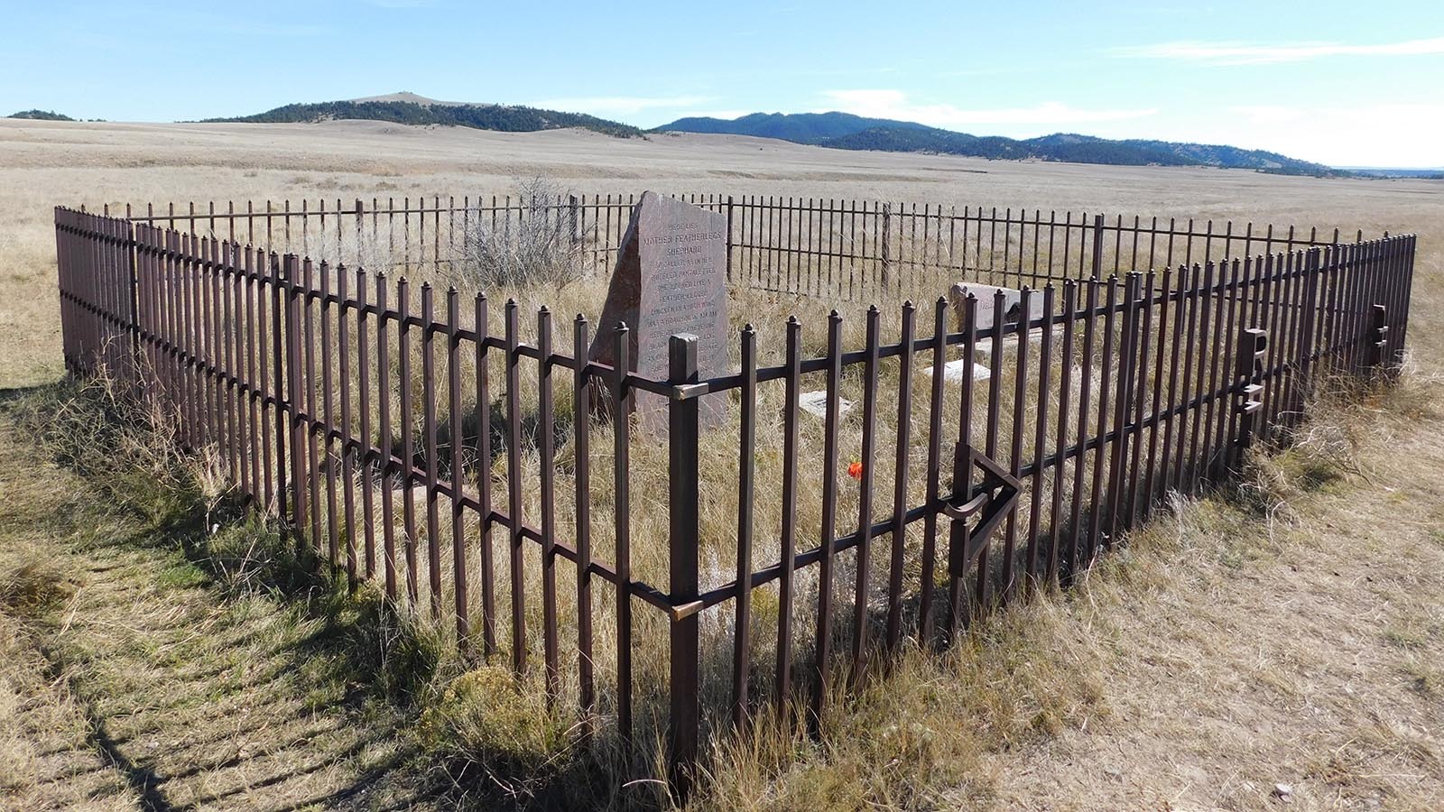 On the remote plains of Wyoming, a 3,200-pound red granite monument marks the grave of Mother Featherlegs, a rare stone tribute to a Wild West prostitute. She was known to stash stolen loot before being murdered by the outlaw “Dangerous Dick.”