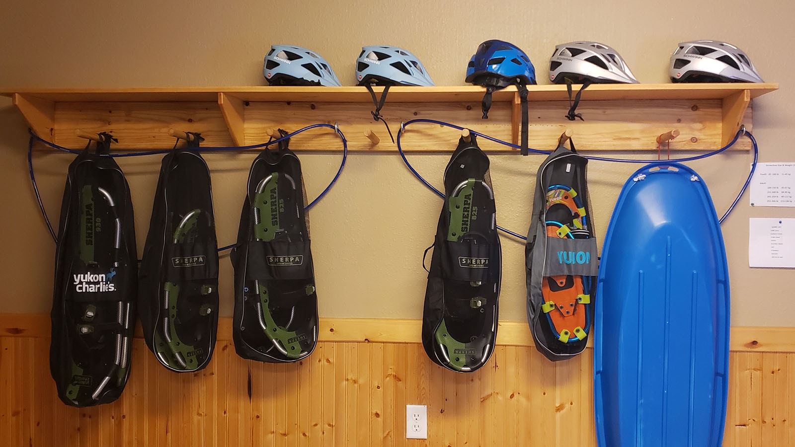 Snowshoes and helmets in the gear garage.