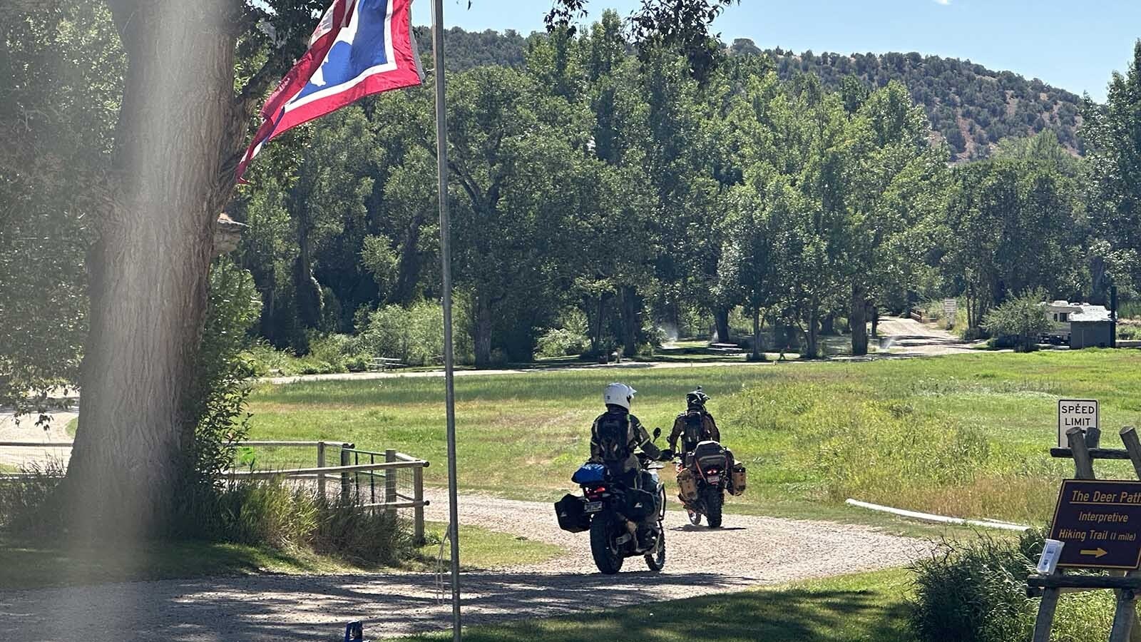 Exploring Wyoming – their motorcycle trip took them through desert but also green areas like the Medicine Lodge Archaeology Site.