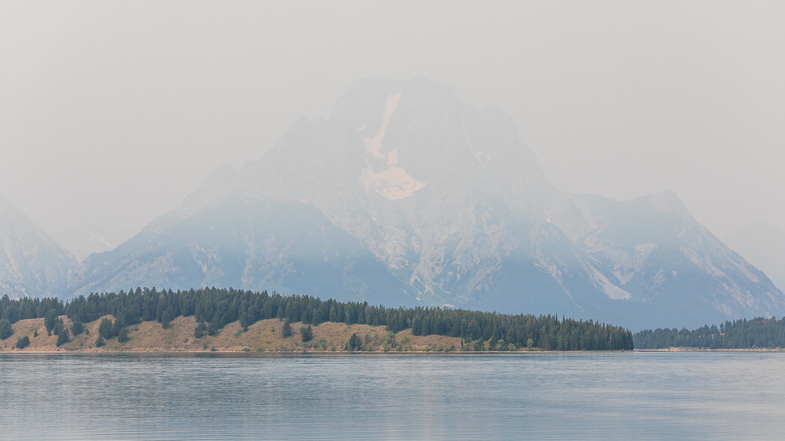 Mount Moran in Grand Teton National Park is shrouded in haze from wildfires in this file photo.