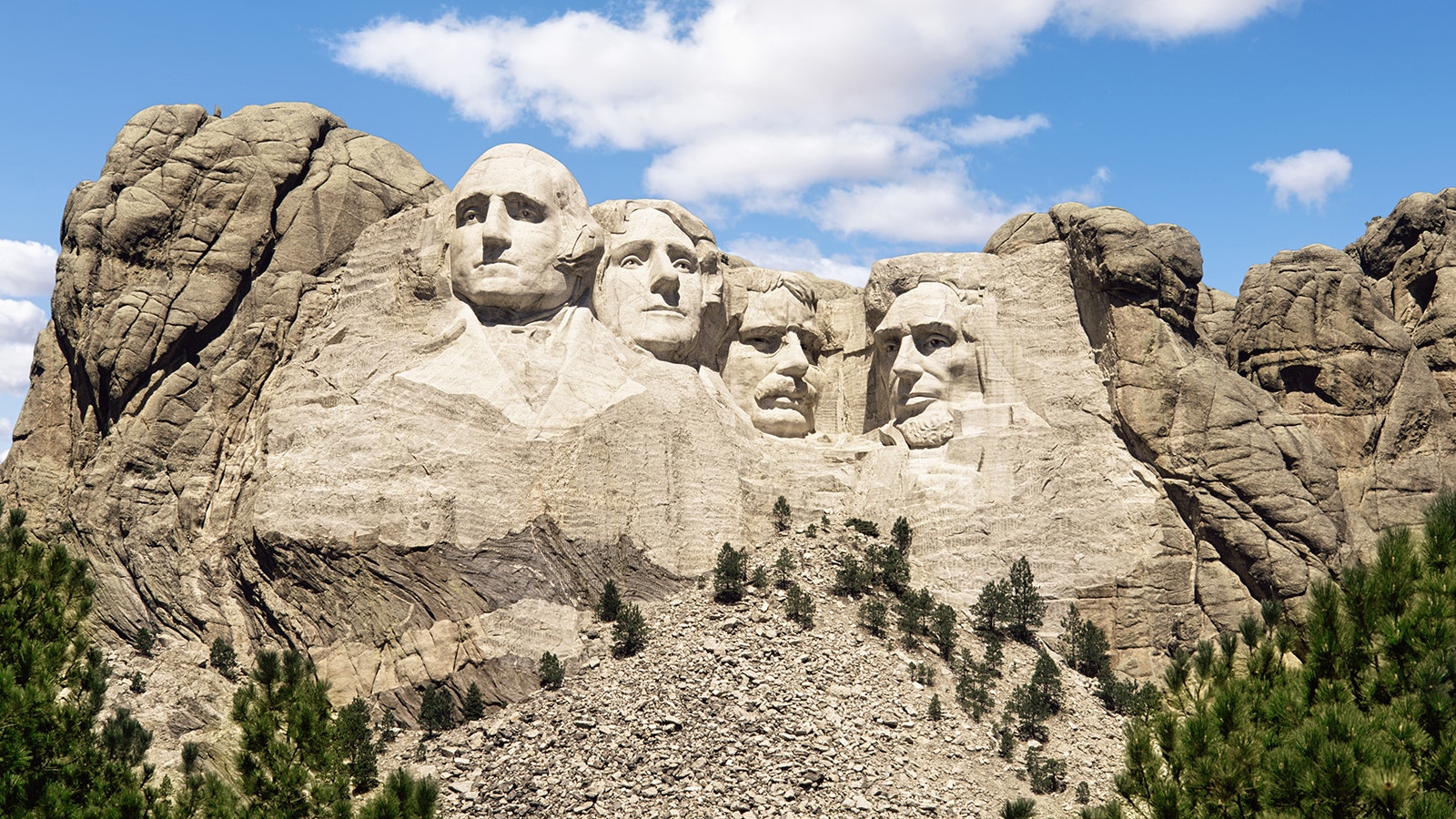 Mount Rushmore in South Dakota took 14 years to build and has become one of the most recognizable American monuments. But it's not what was first envisioned. The original plan was for them all to also have their torsos carved into the mountain.