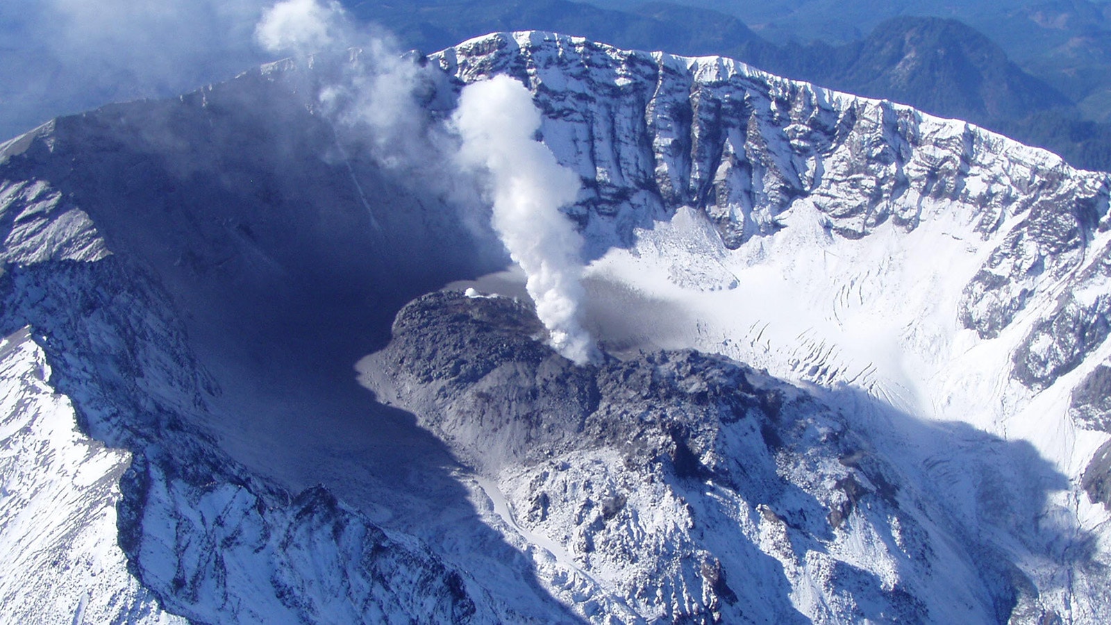 This photo taken Oct. 11, 2004, by the U.S. Geological Survey shows Mount St. Helens' crater, dome and uplift from the northeast. Scientists are keeping watch for an eruption as the volcano continually releases steam.