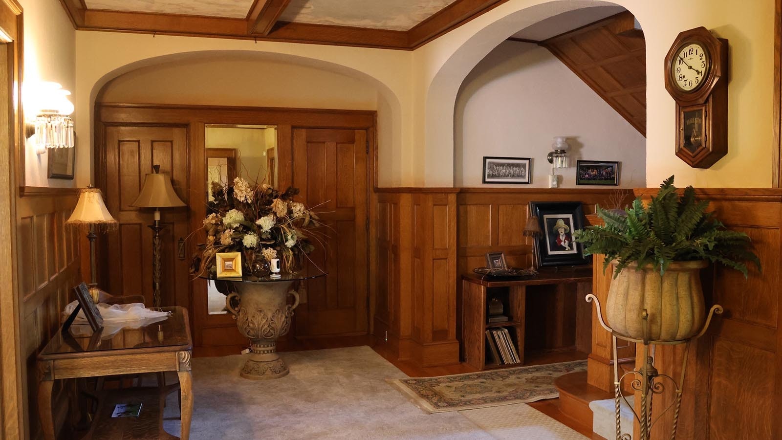 The large entry room into the house features classic woodwork.