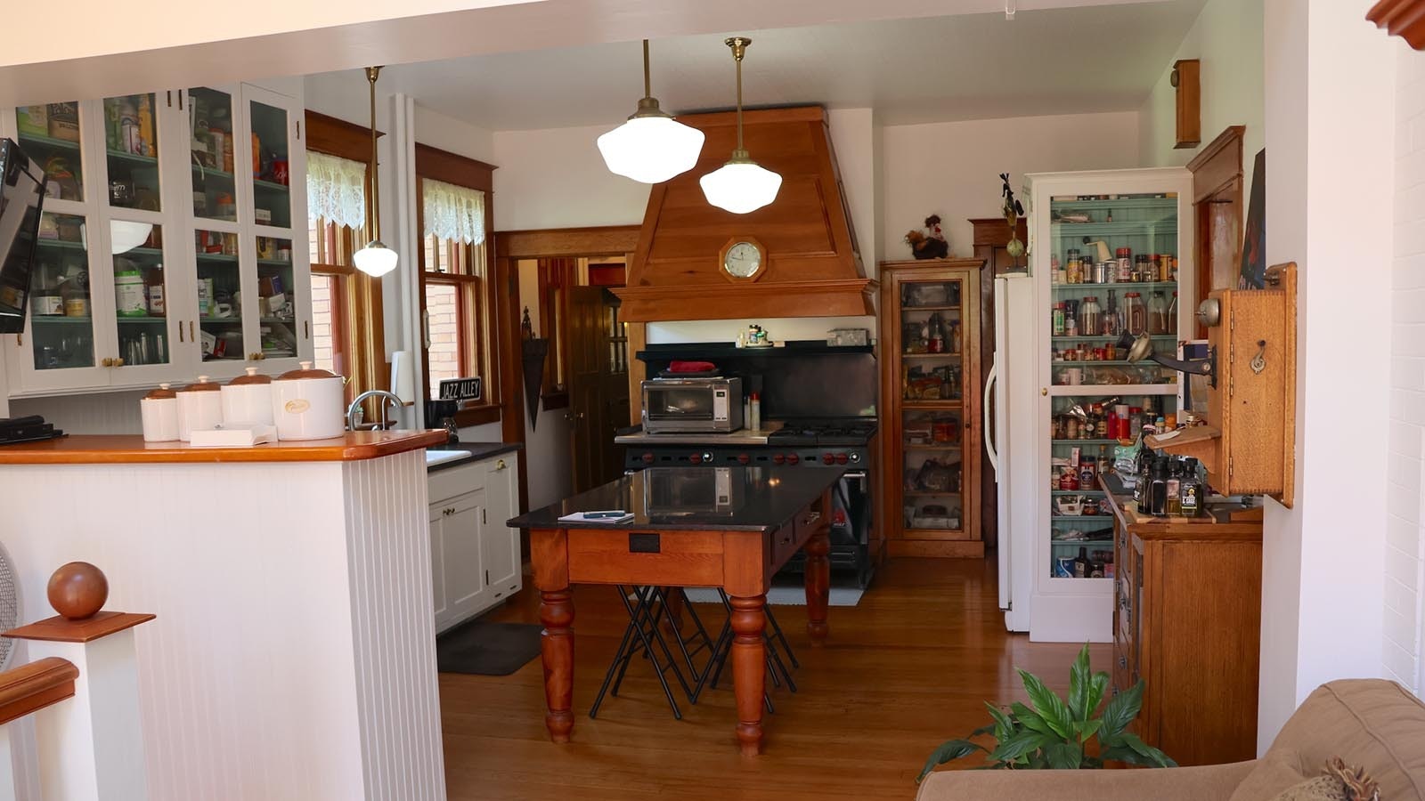 The kitchen of the Mount View home has been updated, but still retains the original cabinets and cupboards.