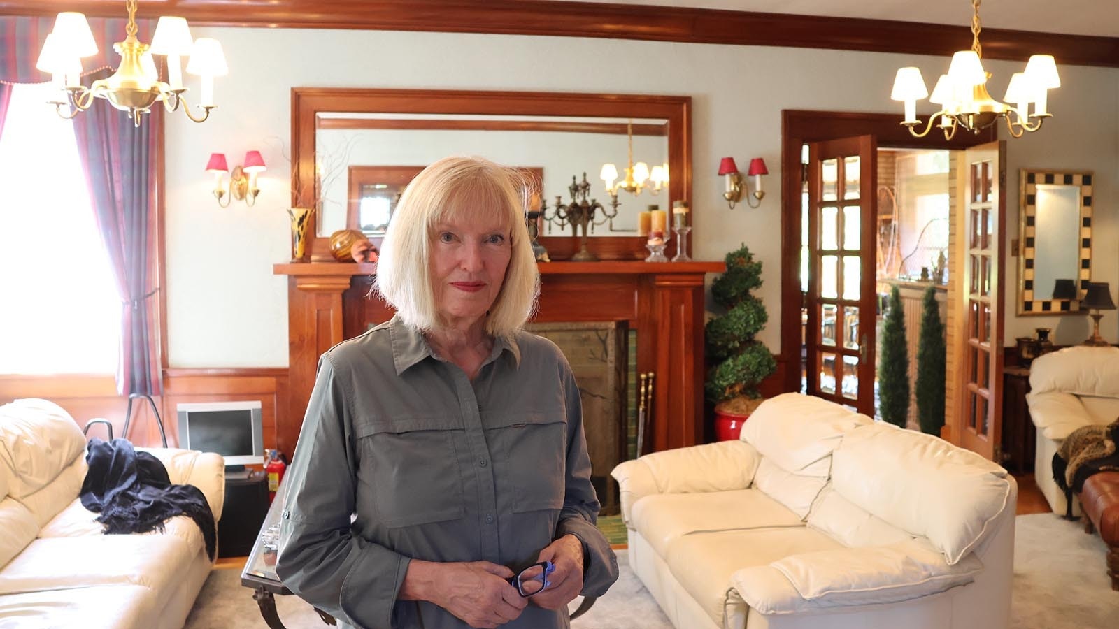 Mount View owner Susan Brayton stands in the more than 6,000-square-foot home’s living room.