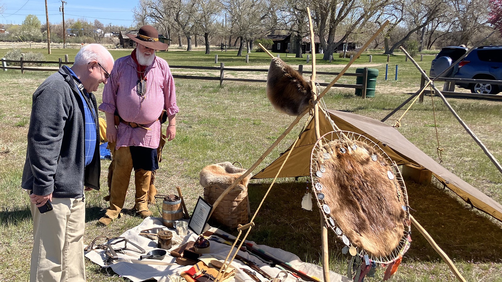 Casper’s Dale Gregory explains his mountain man camp to a visitor at Fort Caspar.