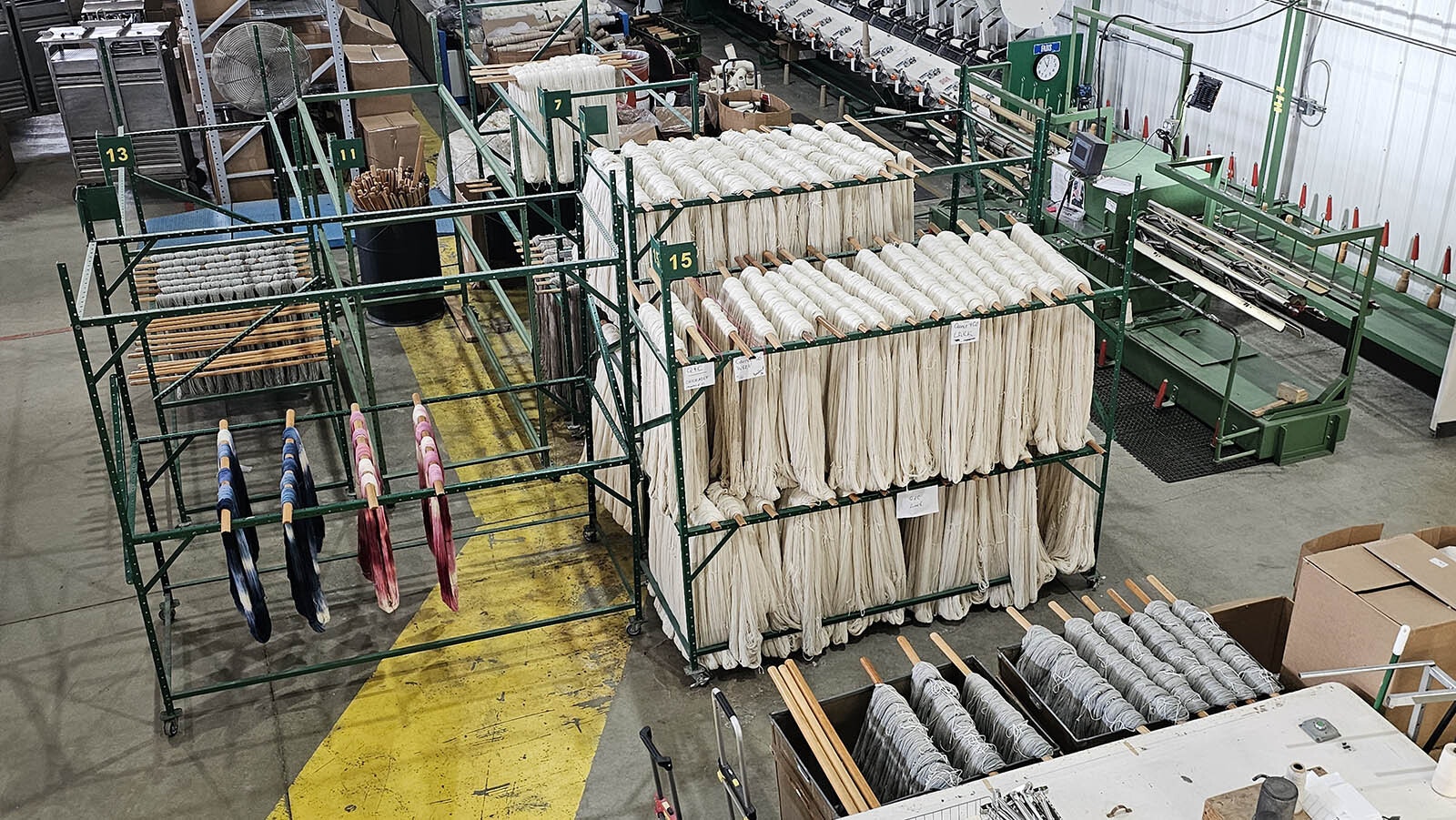 Skeins of white wool yarn await a dunk in a dye vat.