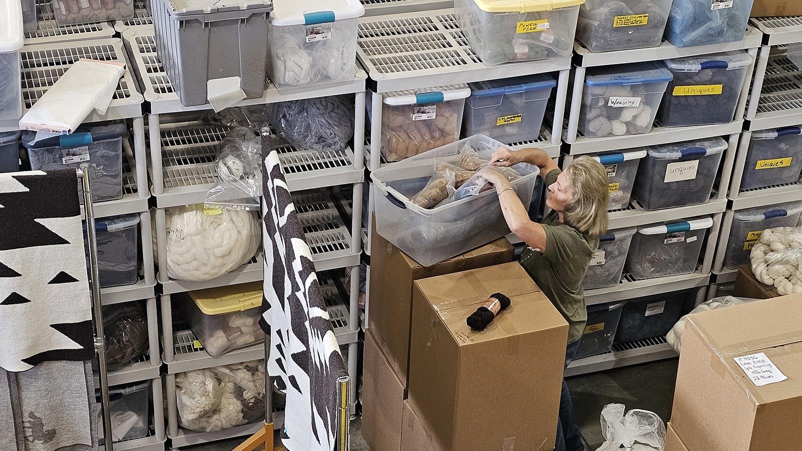 A worker is filling an order for yarn. Mountain Meadow Wool gets orders from all over the country for its premium, soft Wyoming wool.