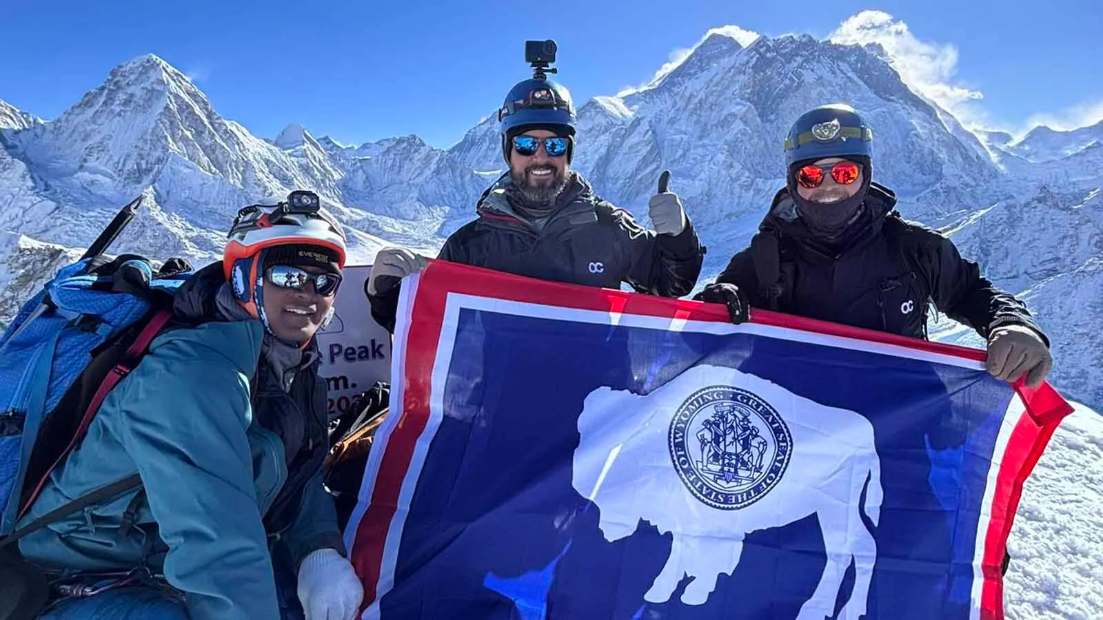 Keith Leithead, center, and Pete Baxendale at the summit of Lobouche East in the Himalayas.