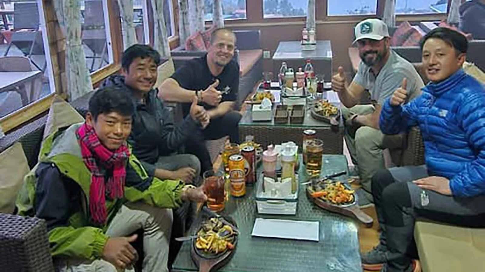 Pete Baxendale and Keith Leithead celebrated the end of their trek with their two porters and guide.