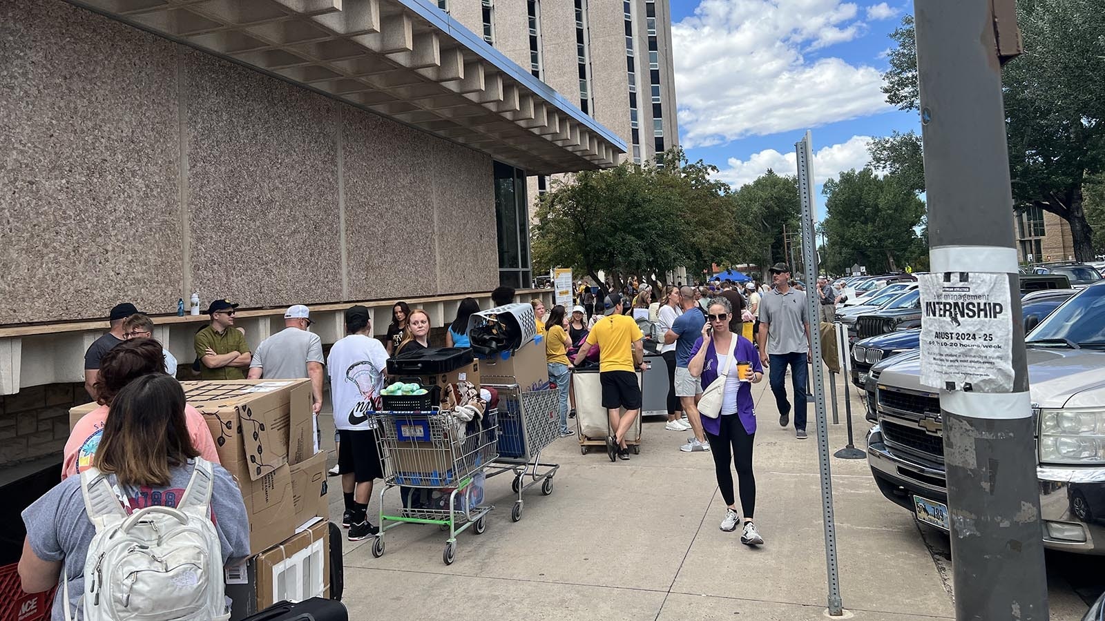 A line backs up all the way from the White Hall dormitory to the Washakie Dining Center on the University of Wyoming campus during Move-In Day on Friday.