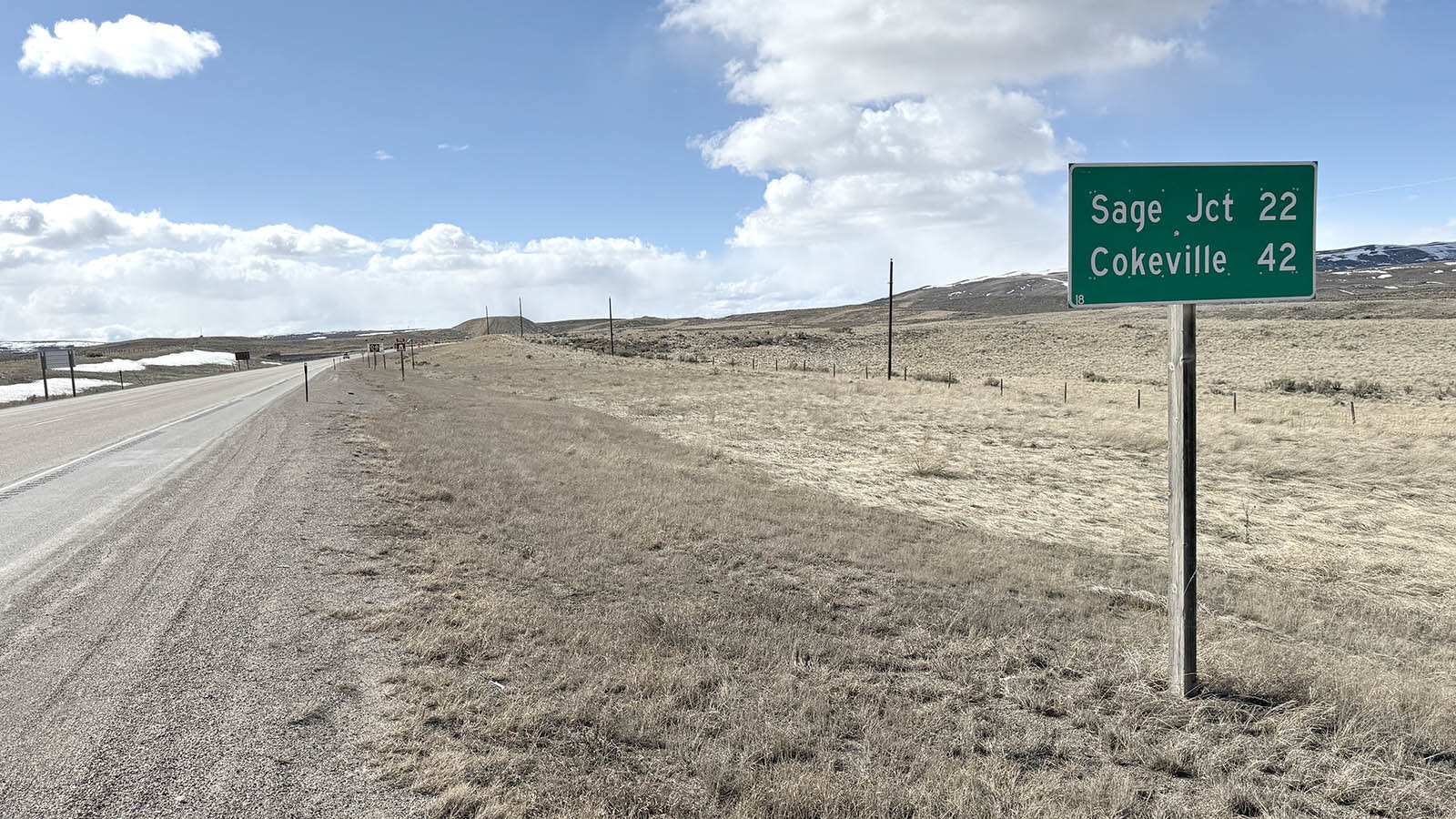 A 2.71-mile stretch of US Highway 30 near the Kemmerer port of entry will be realigned to the north so that a coal mine operator can access coal reserves. A Union Pacific railroad runs under the road just past the mile marker sign, with the Naughton coal-fired power plant located to the south.