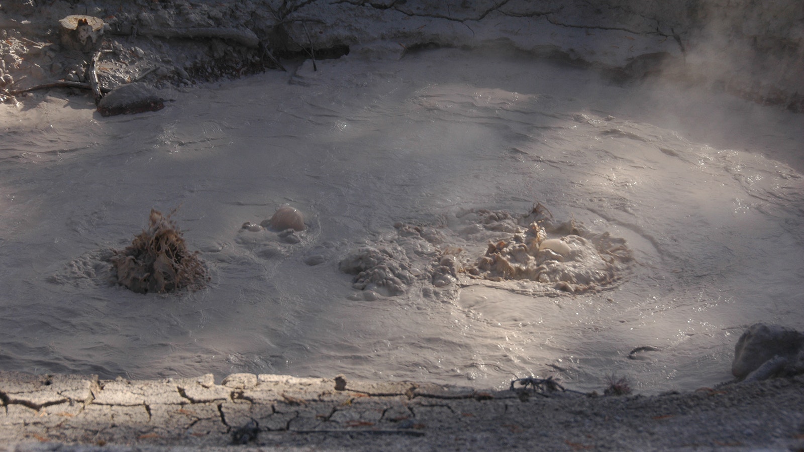 Nobody knows when or how "Infrastructure Spring" appeared in Yellowstone's West Thumb Geyser Basin, but it's one of the most unique thermal features in the park. The water that created the mudpot flows through old pipes.