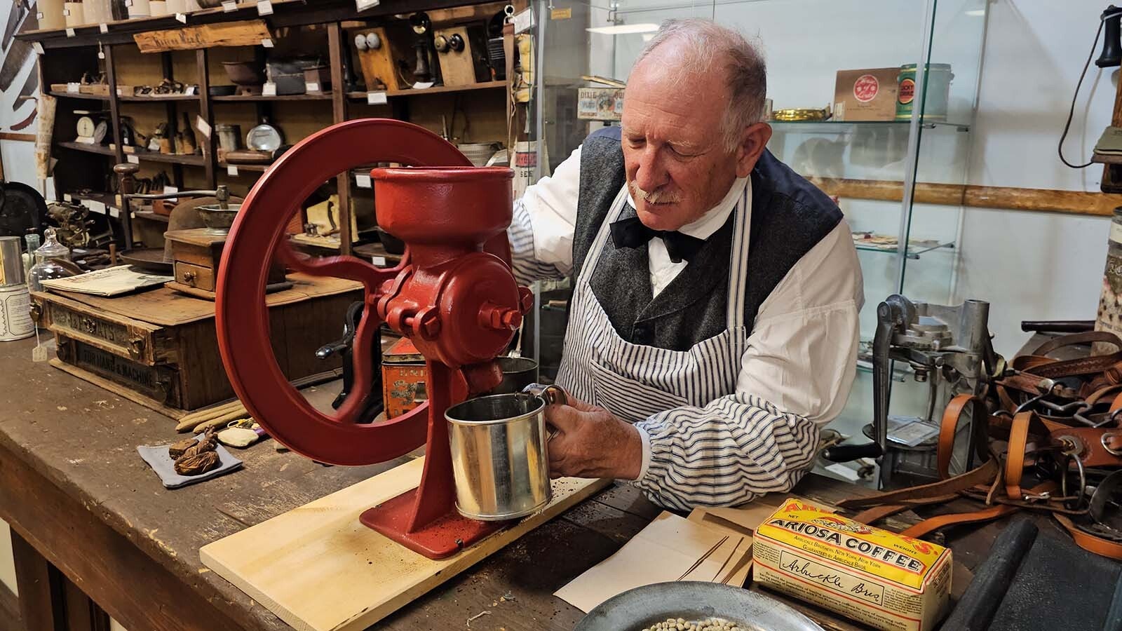 Jim Robinson demonstrates how to make cowboy coffee out of Arbuckle's Ariosa Coffee. The brand was the first to figure out how to distribute quality pre-roasted coffee beans and because the most popular brand in the West during the cattle drive era.