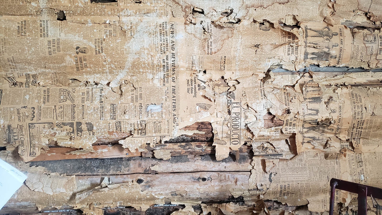 Newsprint was plastered to the interior walls of this mansion-like cabin on display at the Little Snake River Museum in Savery. Sometimes the year of the newspaper is visible along with interesting stories and advertisements.