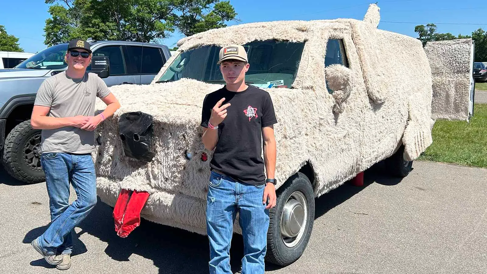 Parker Williams, 20, right, and his friend Seth Siebert spent about four days building their version of the iconic Dumb and Dumber Mutt Cutts sheepdog van.