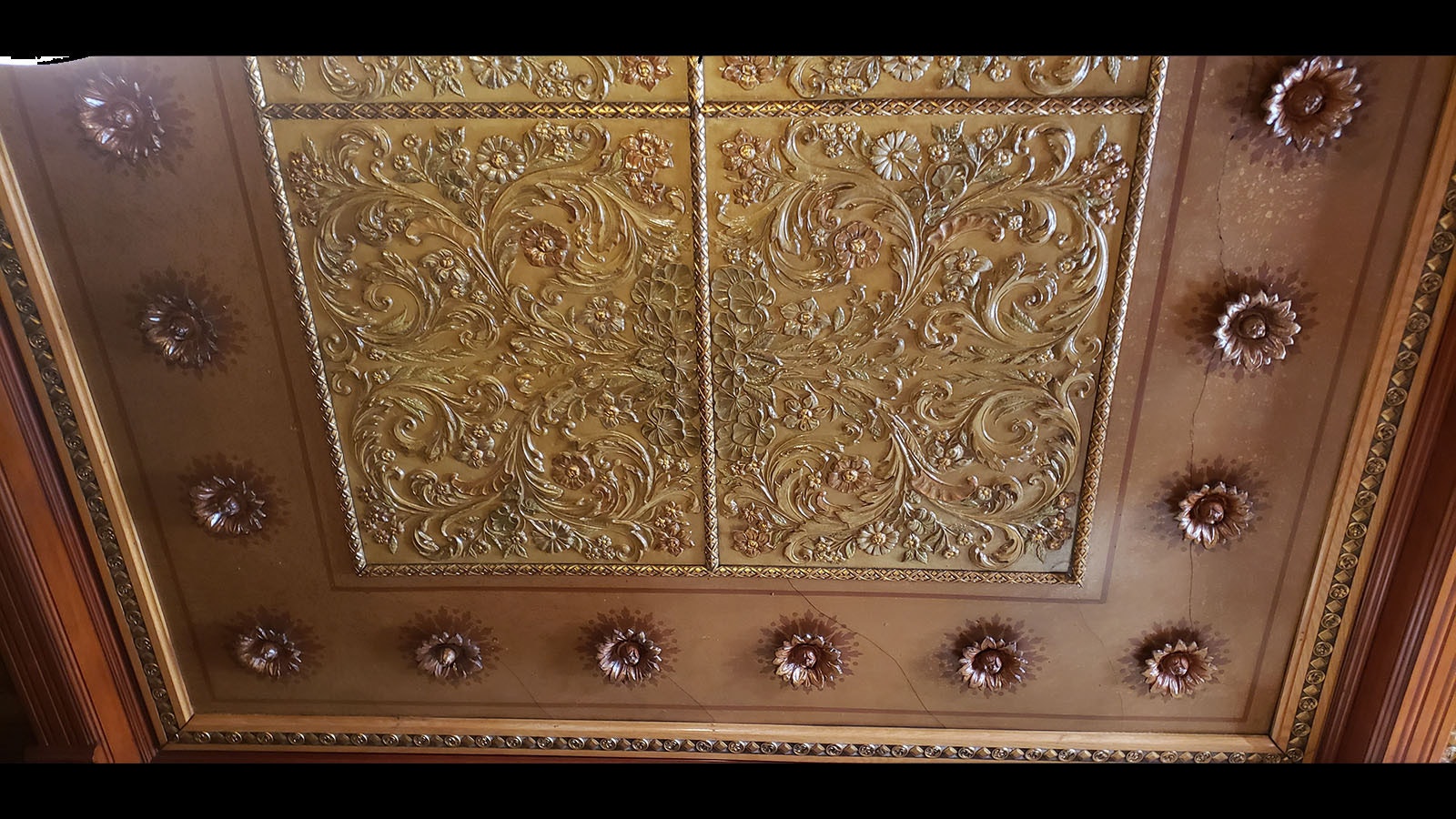 The ceiling panels were a gift from Buffalo Bill Cody. They are carved buffalo hide crafted by Frank Meanea. There isn't another like it in the world.