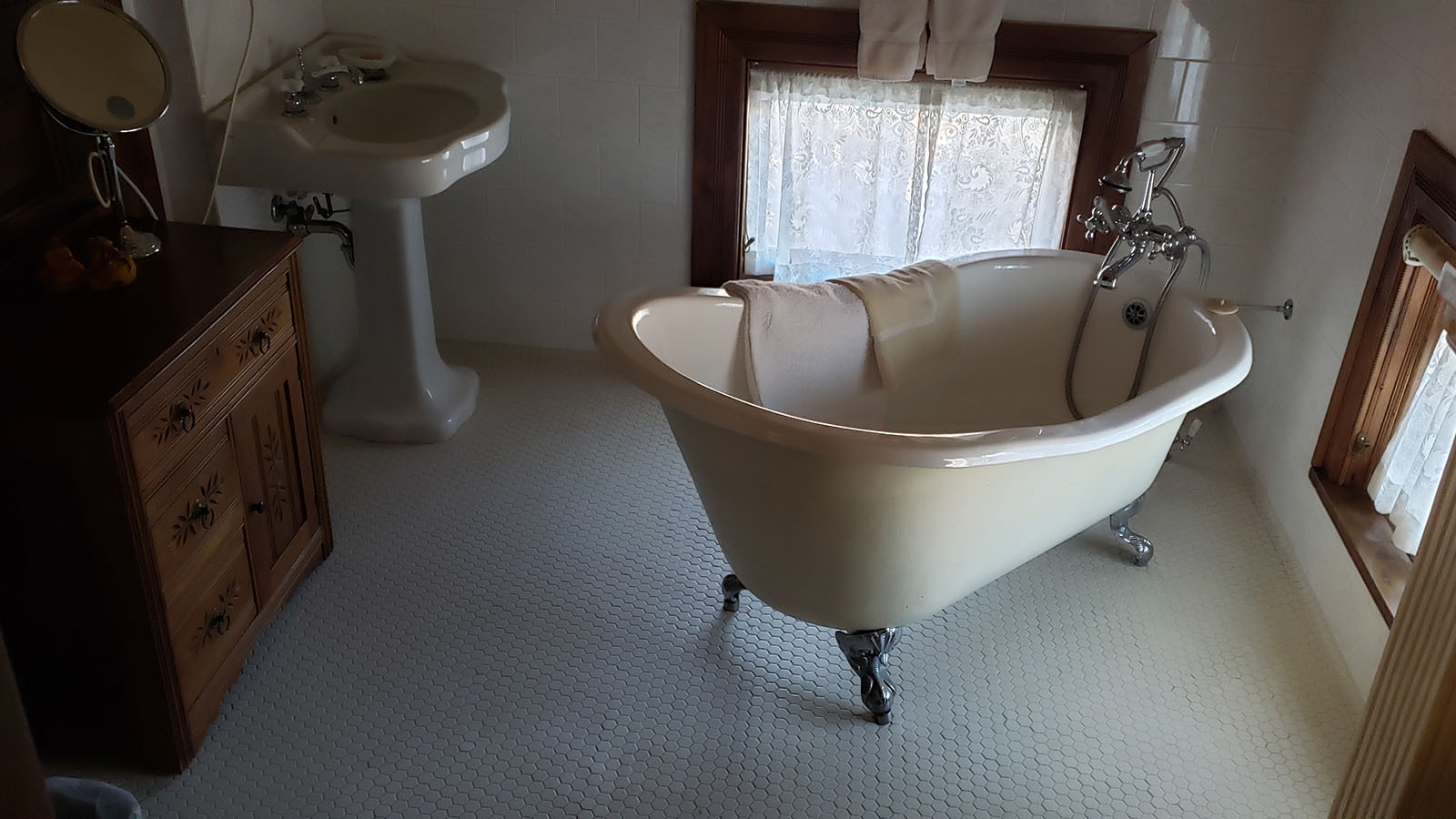 The clawfoot tubs and porcelain sinks are original to the mansion.