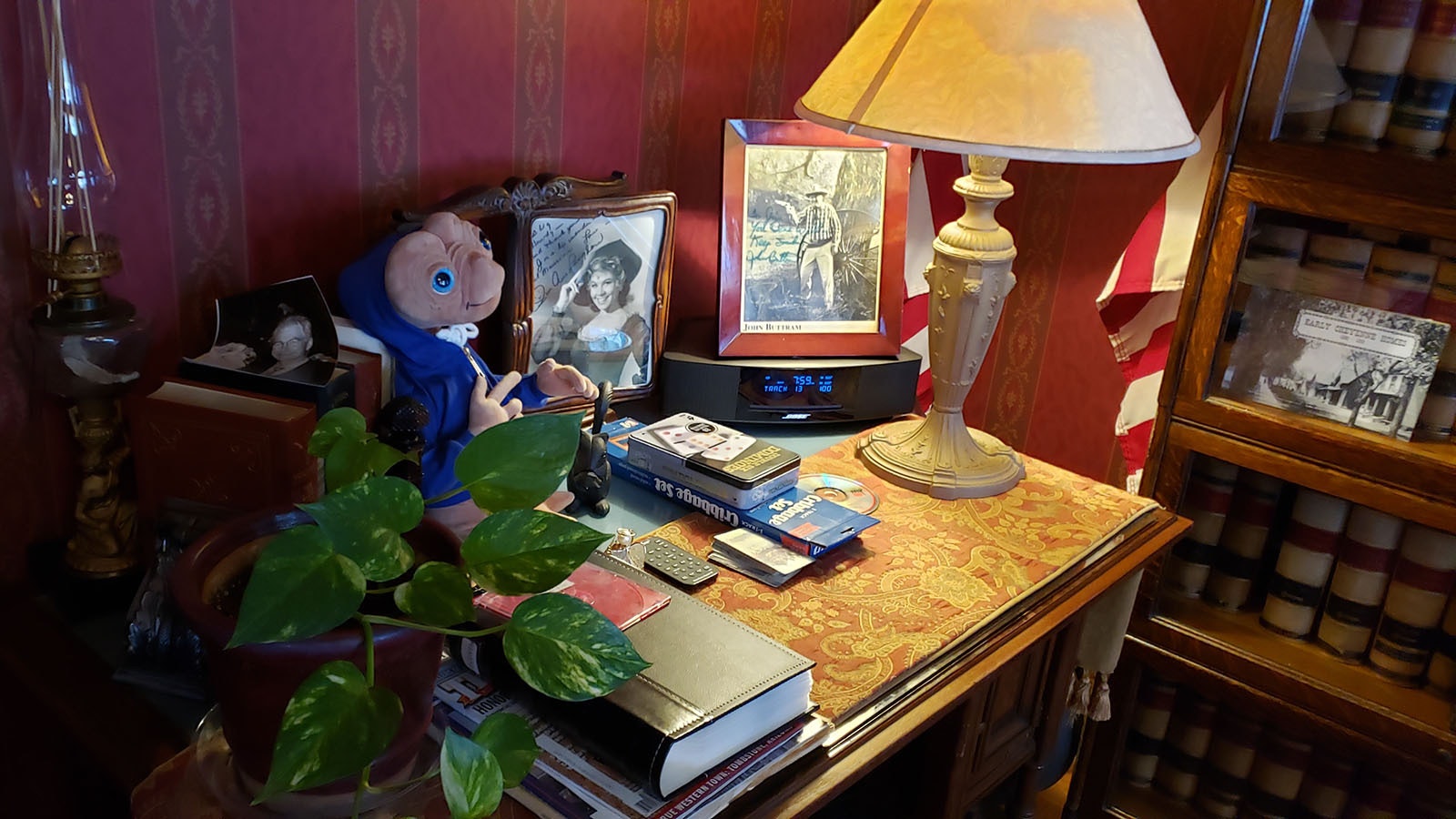 The library desk in the Nagle-Warren Mansion includes signed photographs from guests over the years.