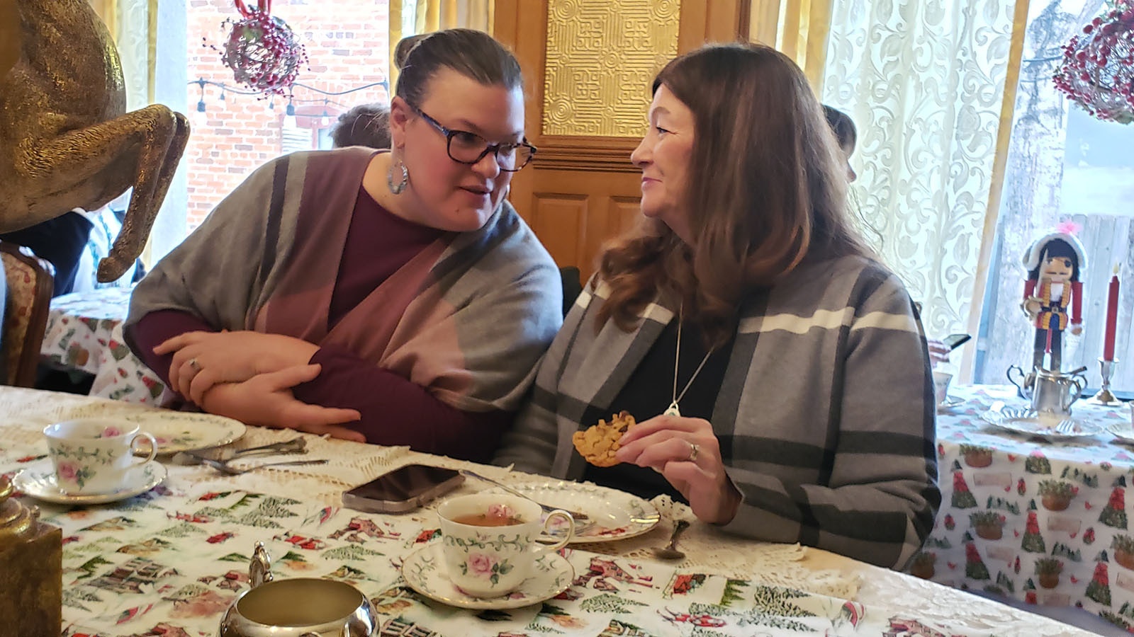 A pair of guests confer about their favorite jams during the Nagle-Warren Mansion's afternoon tea.