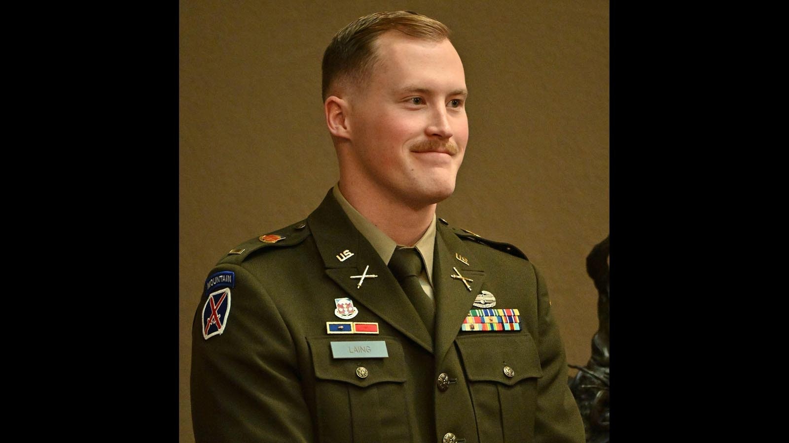 First Lt. Elam Laing stands on the floor of the Wyoming State Senate as he is honored for his work leading a unit in Syria.