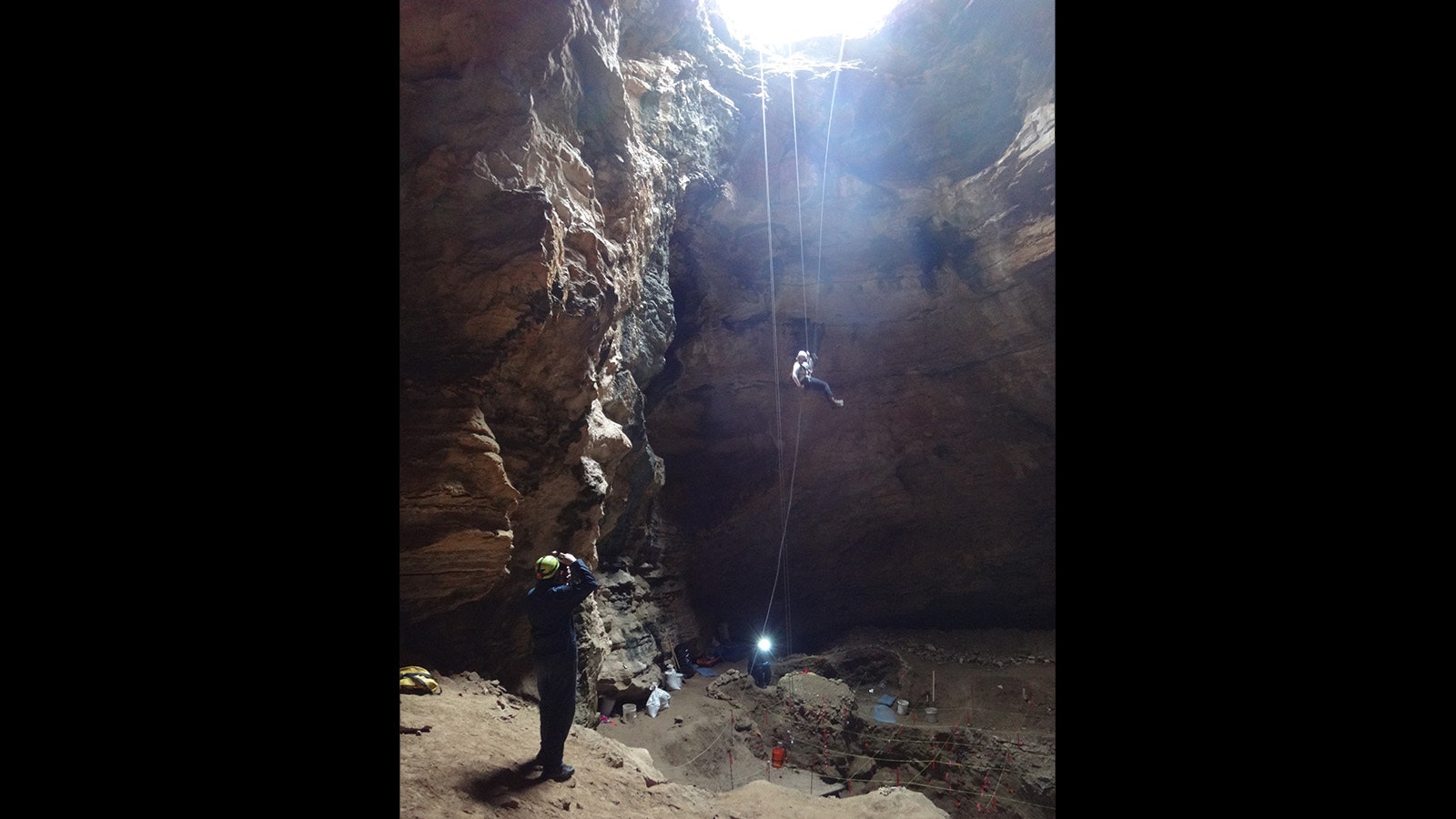 A group studies the depths of Natural Trap Cave in northern Wyoming.