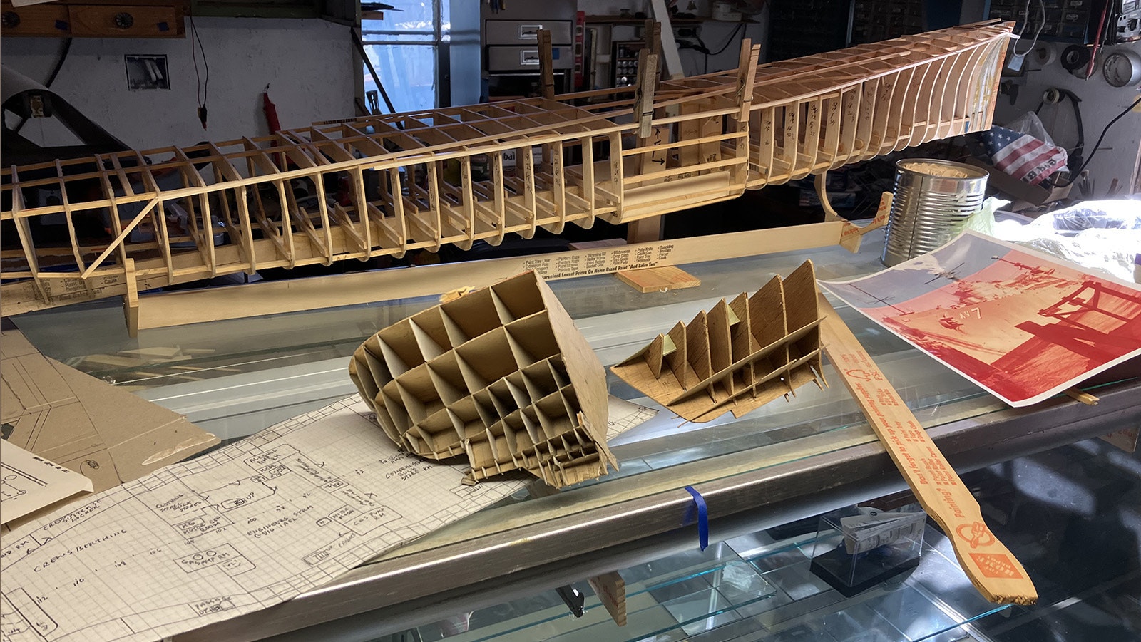 Blueprints and the beginning of a detailed model of the USS Currituck sit in Gene Dickerson’s workshop. He has made several detailed models of ships that were part of his career.