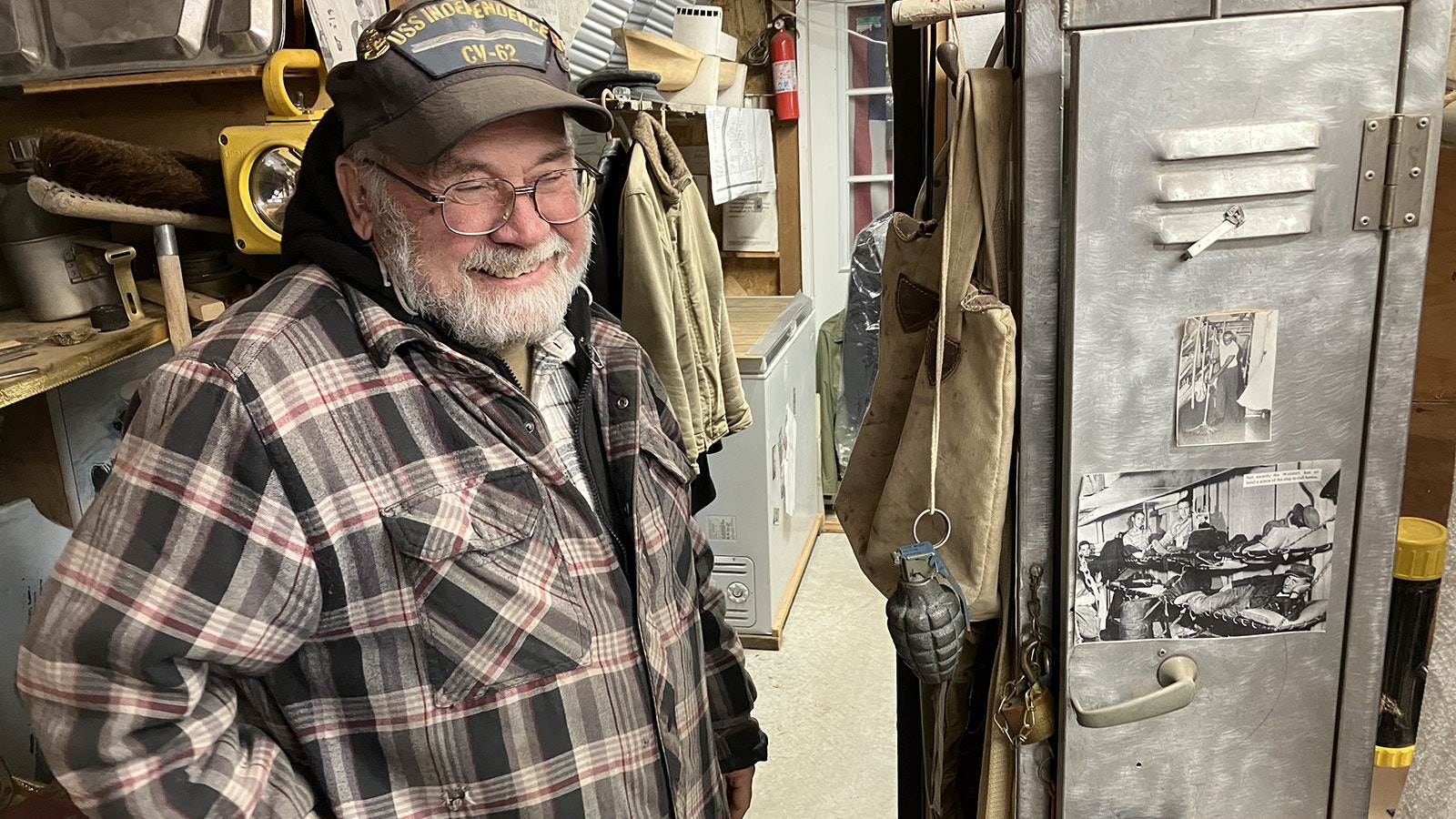 Gene Dickerson stands by the original locker he took off his first ship, the USS Currituck, when it was decommissioned. It’s now part of his museum.