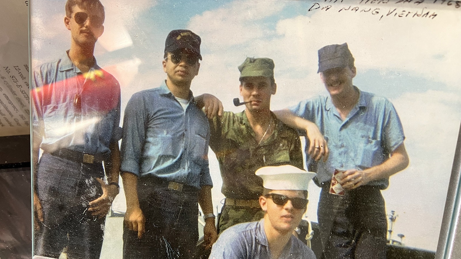 Vietnam veteran Gene Dickerson, in camouflage with pipe, poses with buddies in Da Nang, Vietnam in a photo displayed in his museum.
