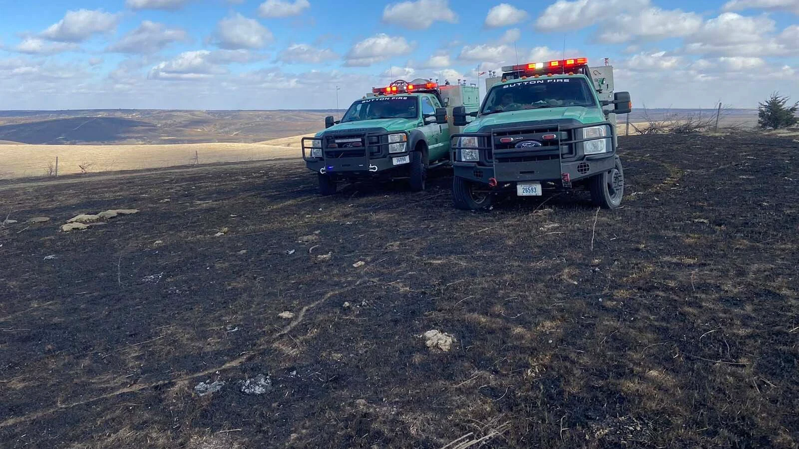 Chad Hall and Thomas Barnes both volunteered to help neighbors threatened by the Cottonwood Fire in Nebraska, which drew firefighters from out of state.