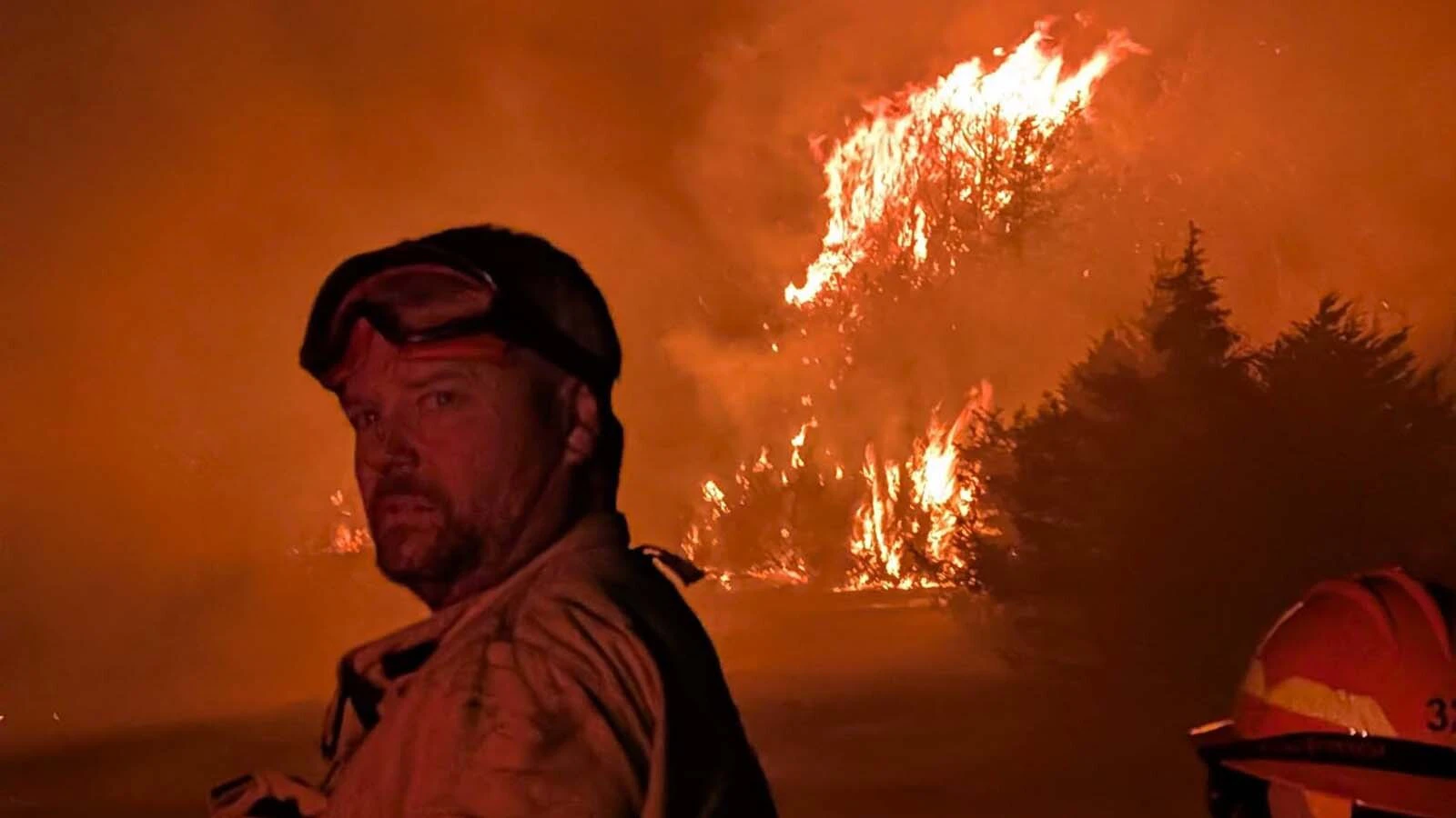 Chad Hall and Thomas Barnes both volunteered to help neighbors threatened by the Cottonwood Fire in Nebraska, which drew firefighters from out of state.