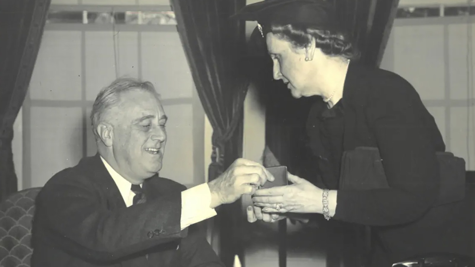 Director of the Mint Nellie Tayloe Ross and President Franklin D. Roosevelt, ca. 1940.