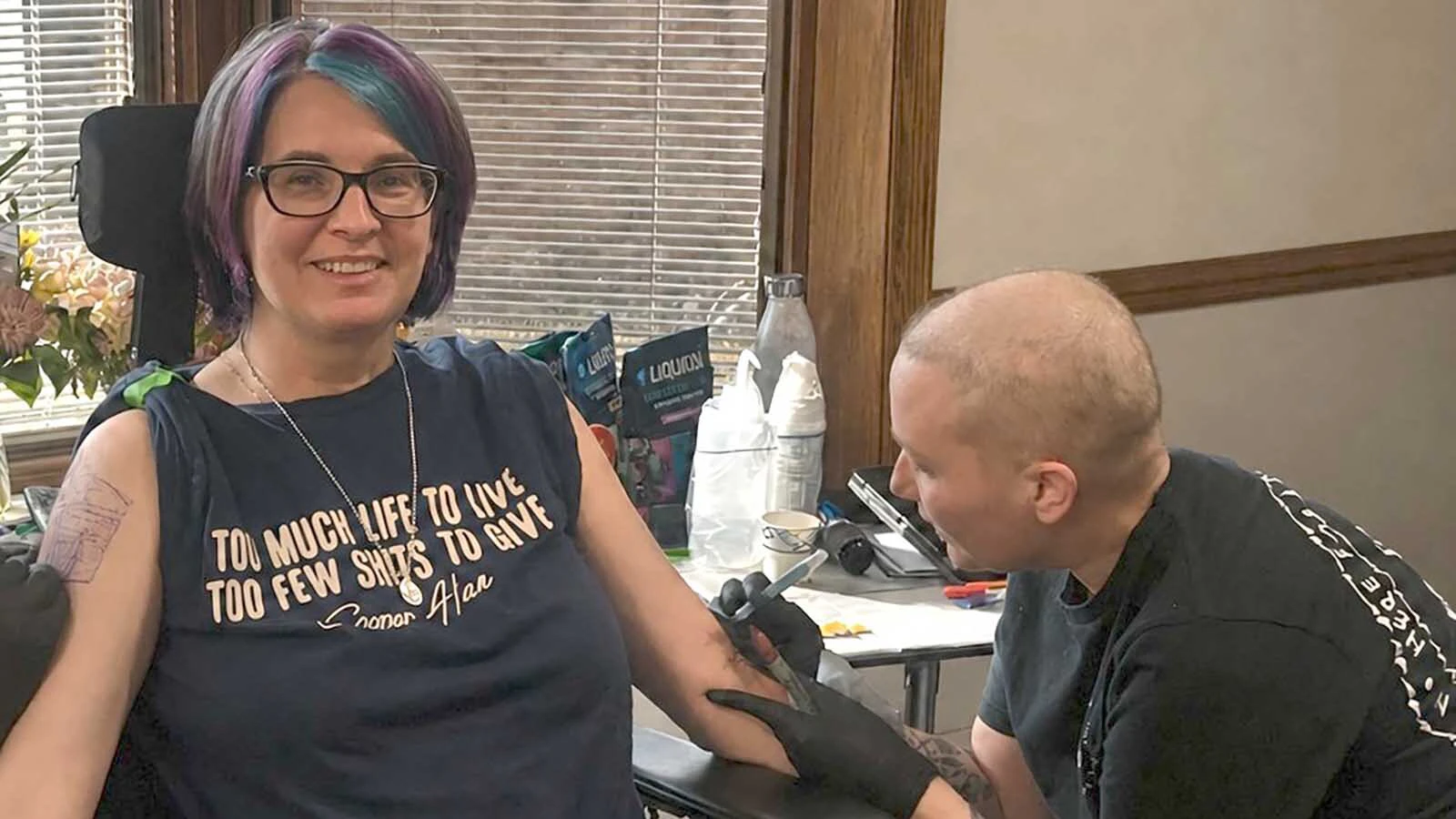 Nelly Brown, right, was in the middle of cancer chemotherapy when she gave Deanna Cotten a sleeve tattoo while Cotten was at Wyoming Hospice.