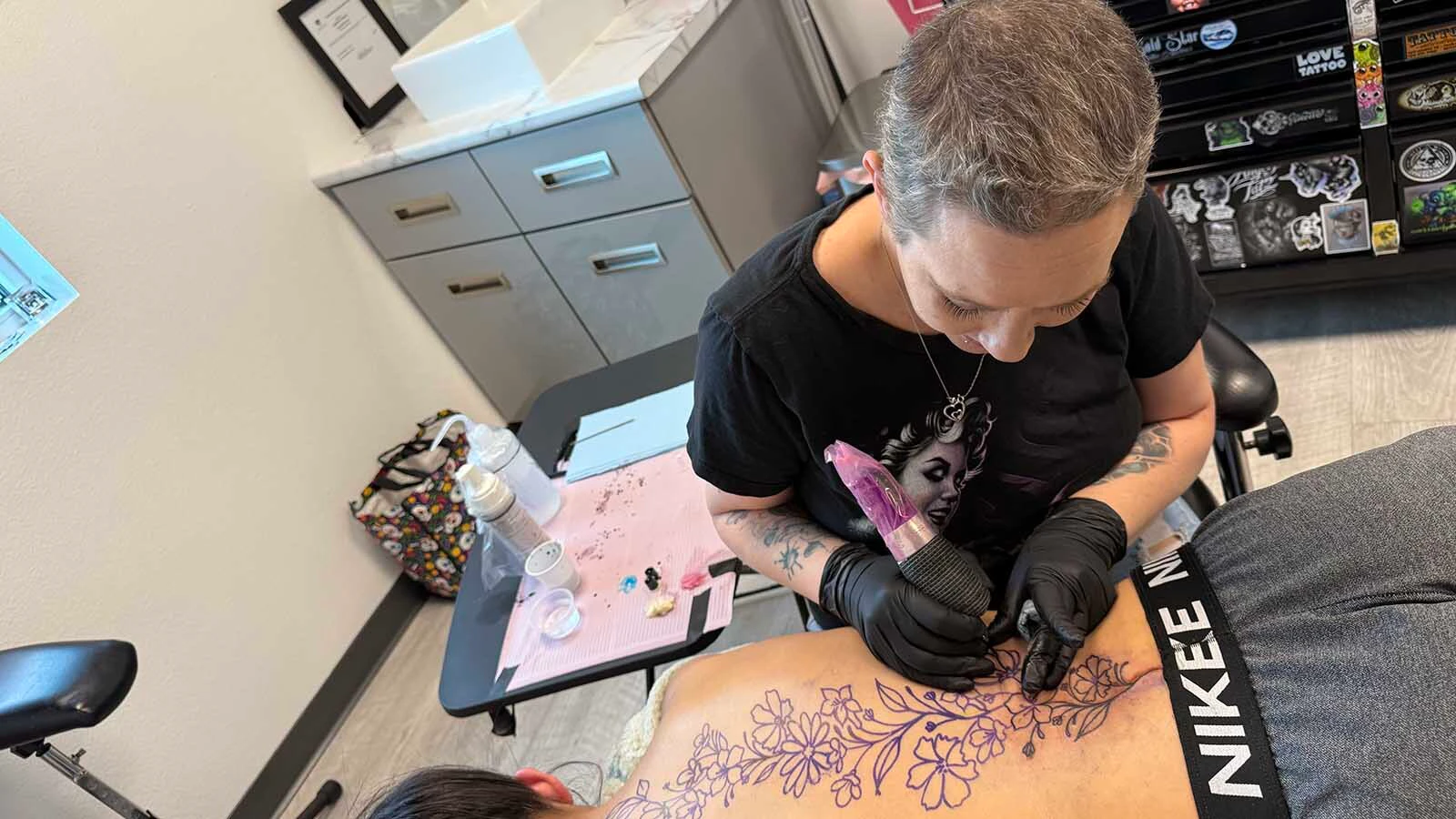 Nelly Brown said her tattoo shop “Rising Above” is about more than tattoos, she wants it to be a place "built on resilience, compassion, and the unshakable belief that our scars do not define us.”
