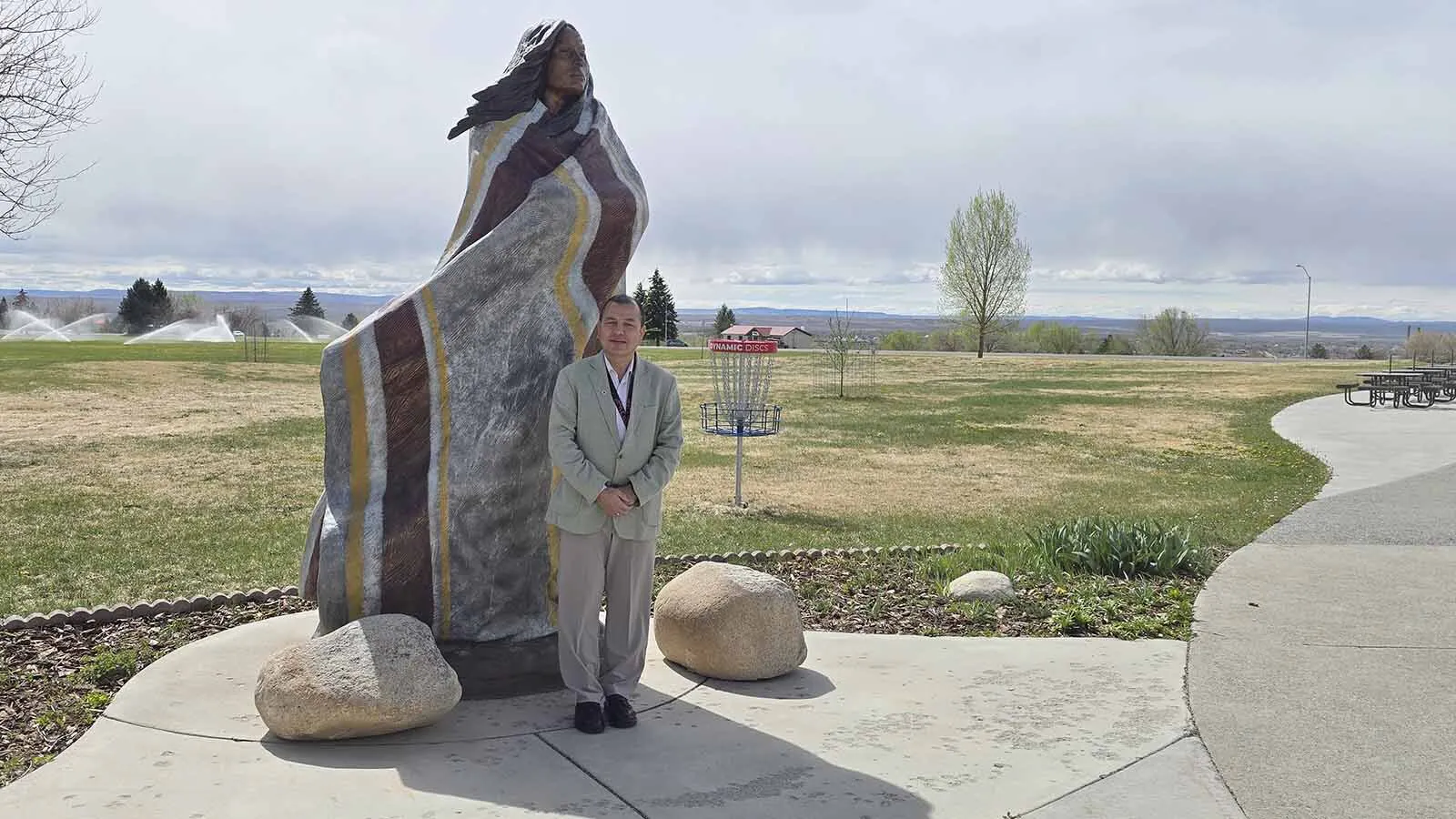 Mohan Dangi poses in front of Central Wyoming College's Sacagawea statue. He still remembers removing snow from the surrounding sidewalks on campus at 3 a.m. in the morning, when he was a CWC student.