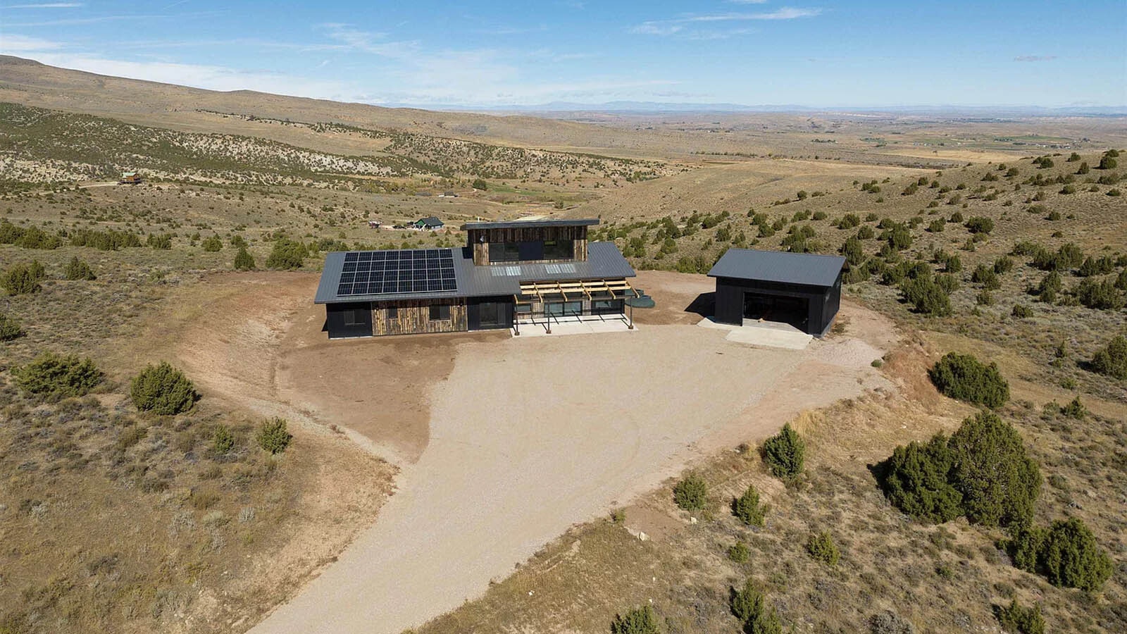 The net zero home has a large bank of solar panels on the roof.