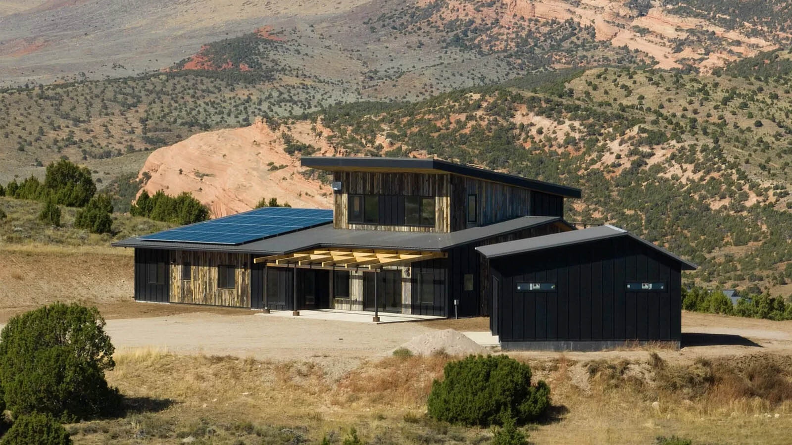 The net zero home near Lander has a spacious house and separate garage.