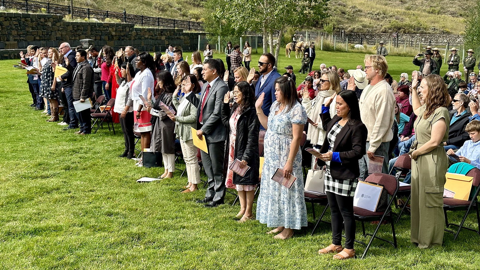 America's newest citizens take their oaths of allegiance during a ceremony at Yellowstone National Park on Thursday.