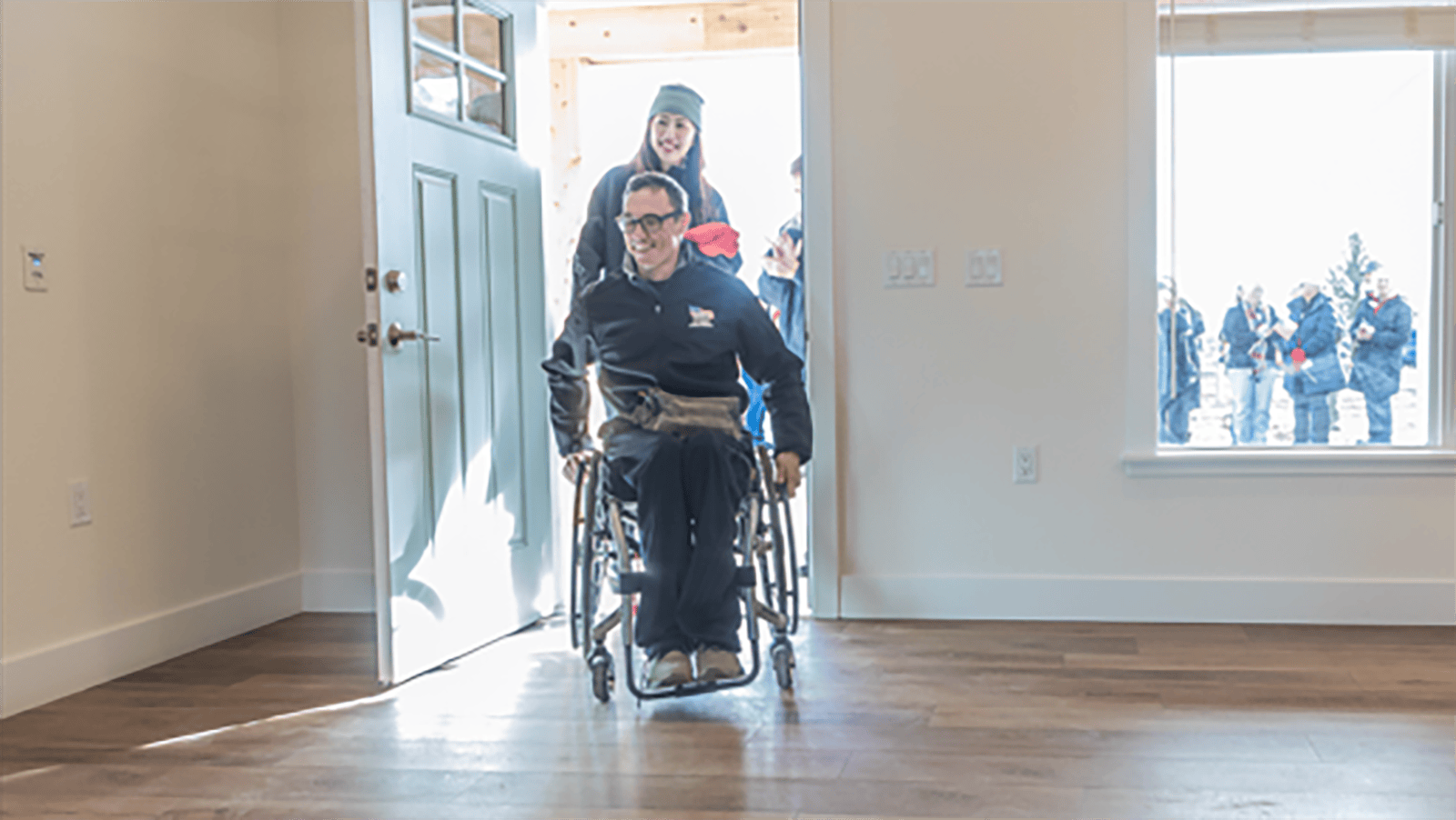 Bryan Price enters his new home following the key ceremony.