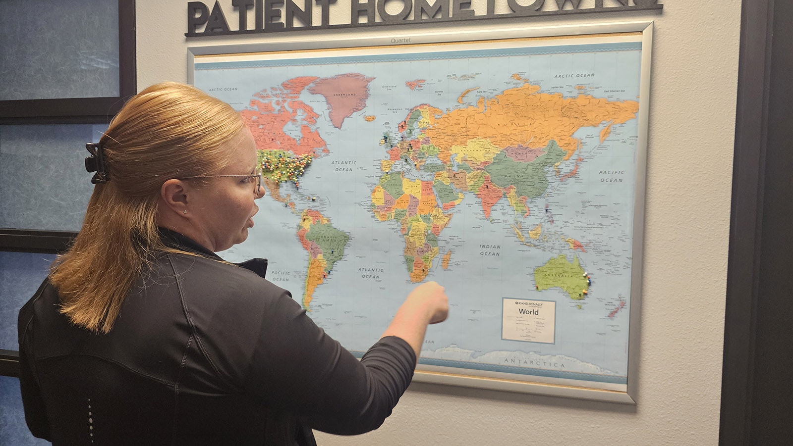 Candy Leggett talks about a push pin map that shows where The McGinley Clinic's patients have come from.