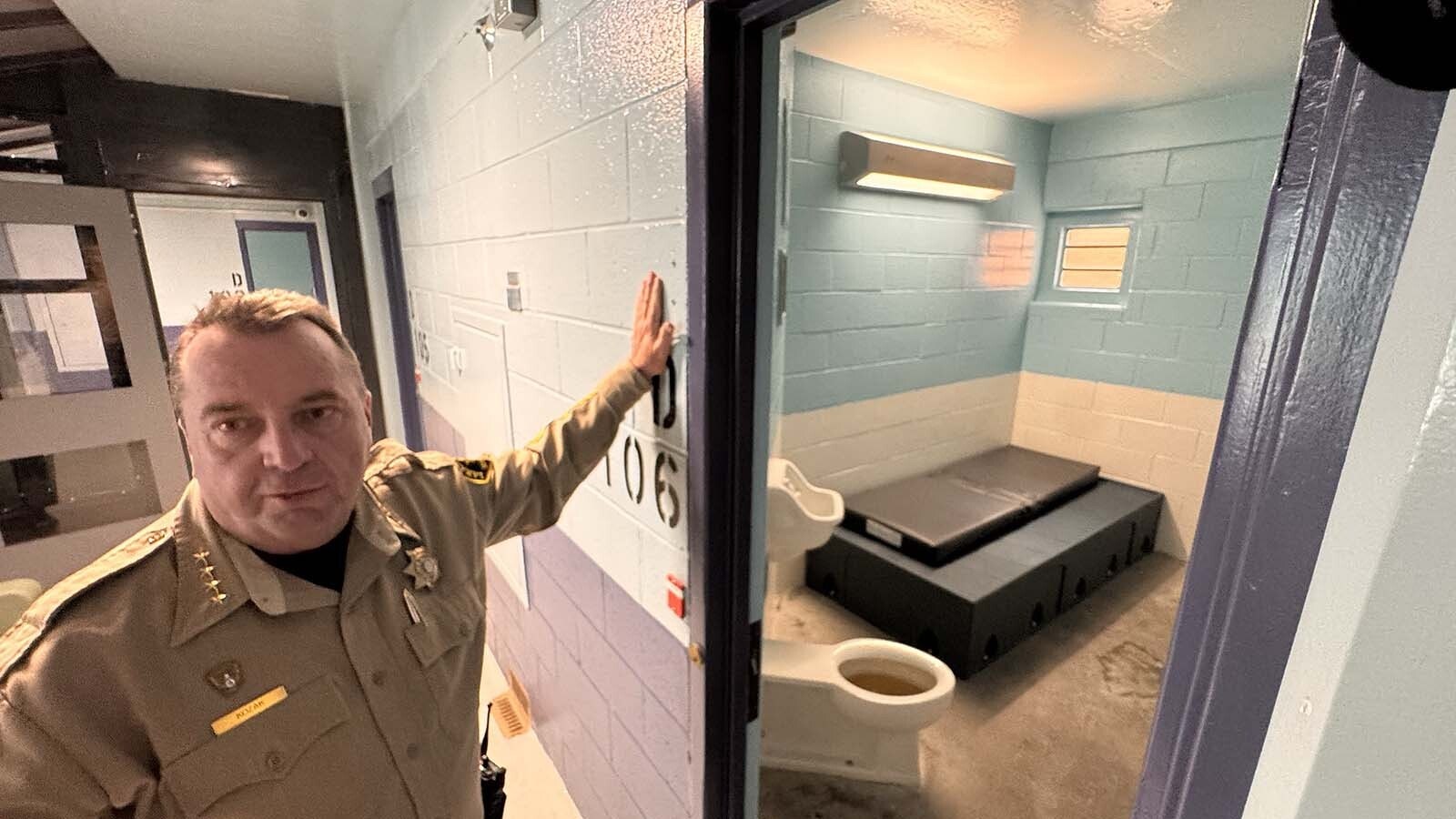 Laramie County Sheriff Brian Kozak outside a typical cell in the new mental health pods at the Laramie County Detention Center. It's been stripped of items someone could use to harm himself.