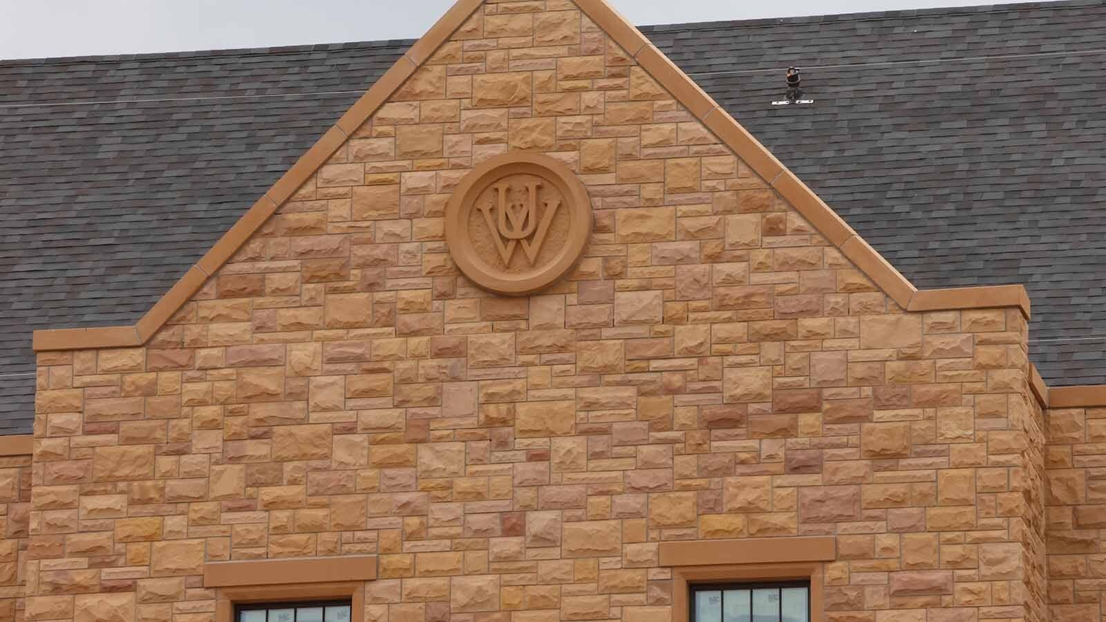 The University of Wyoming symbol is embedded in a roof peak on the South Hall dorm building.