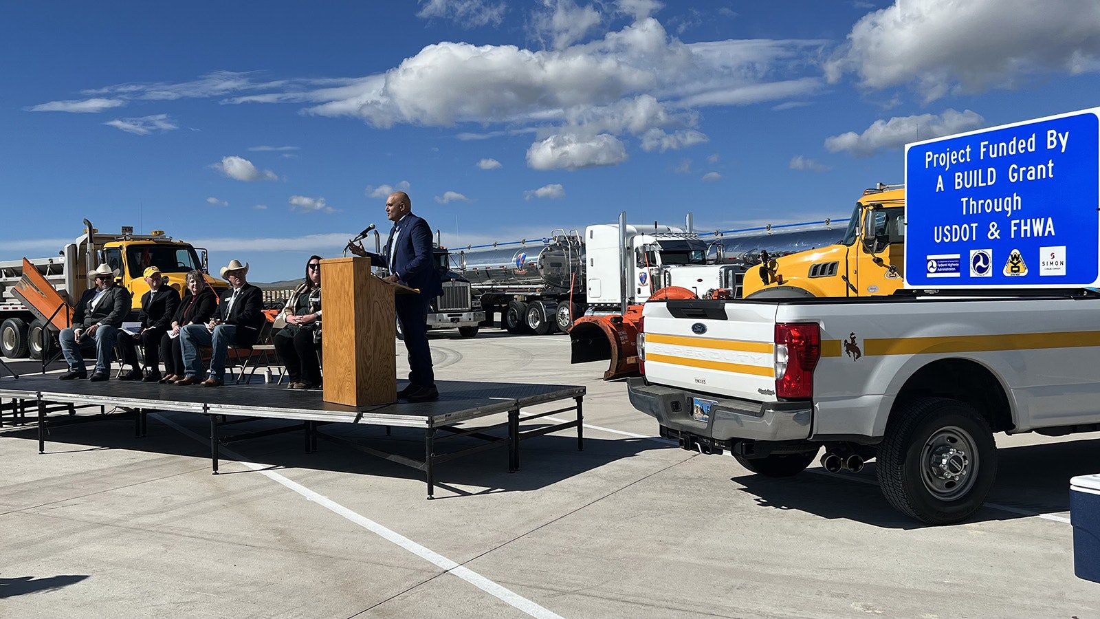 Federal Highways Administrator Shailen Bhatt speaks early Wednesday during a ceremony marking the opening of a new truck driver’s resting lot at Quealy Dome.