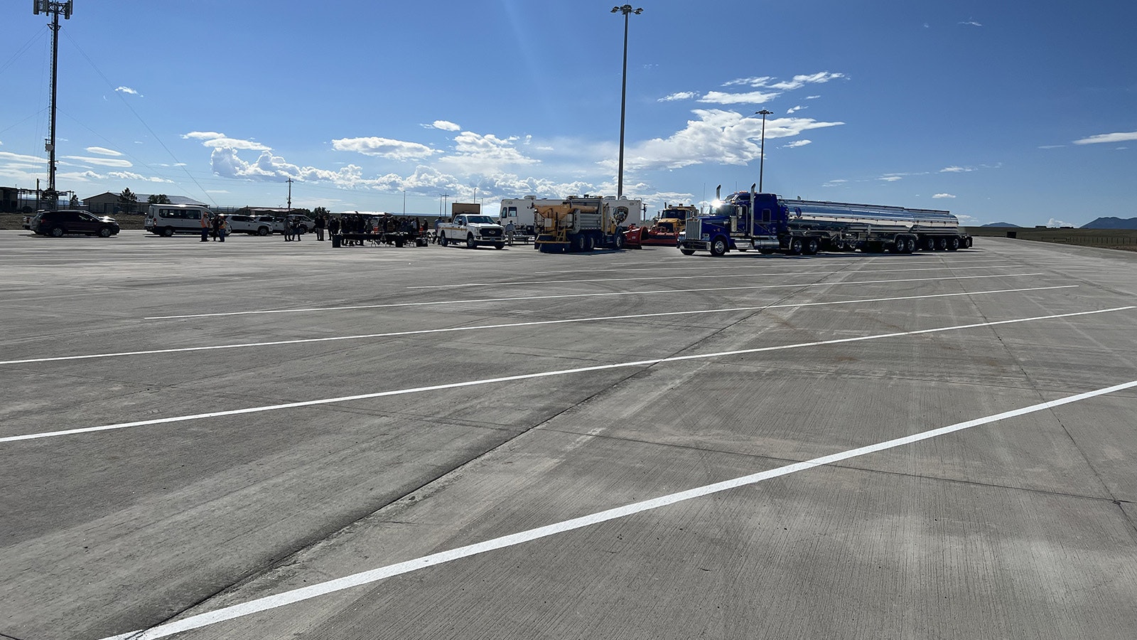 A crowed gathered early Wednesday to celebrate the official opening of a massive new semi-truck parking lot at Quealy Dome along Interstate 80. The lot will give truckers a safe place to wait out winter storms.