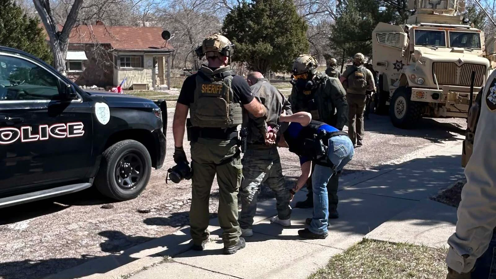 Brandon Suess is taken into custody after a four-hour standoff with police in Newcastle, Wyoming, on Monday, March 23, 2026.