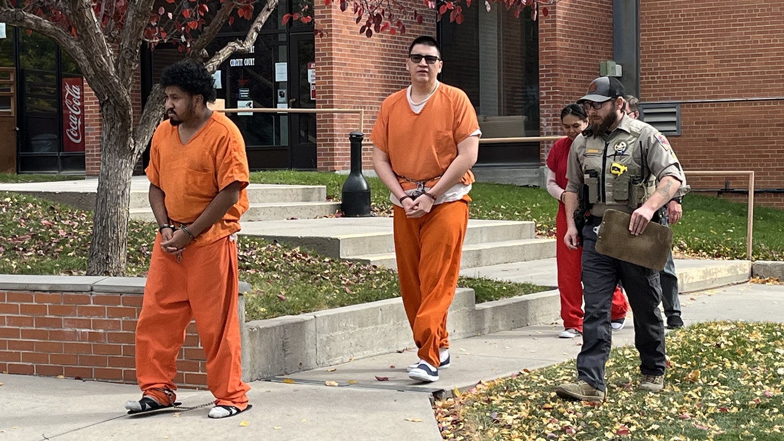 Nicholas Blackburn, center, walked to the Fremont County jail transport van Thursday after pleading not guilty to killing his friend.